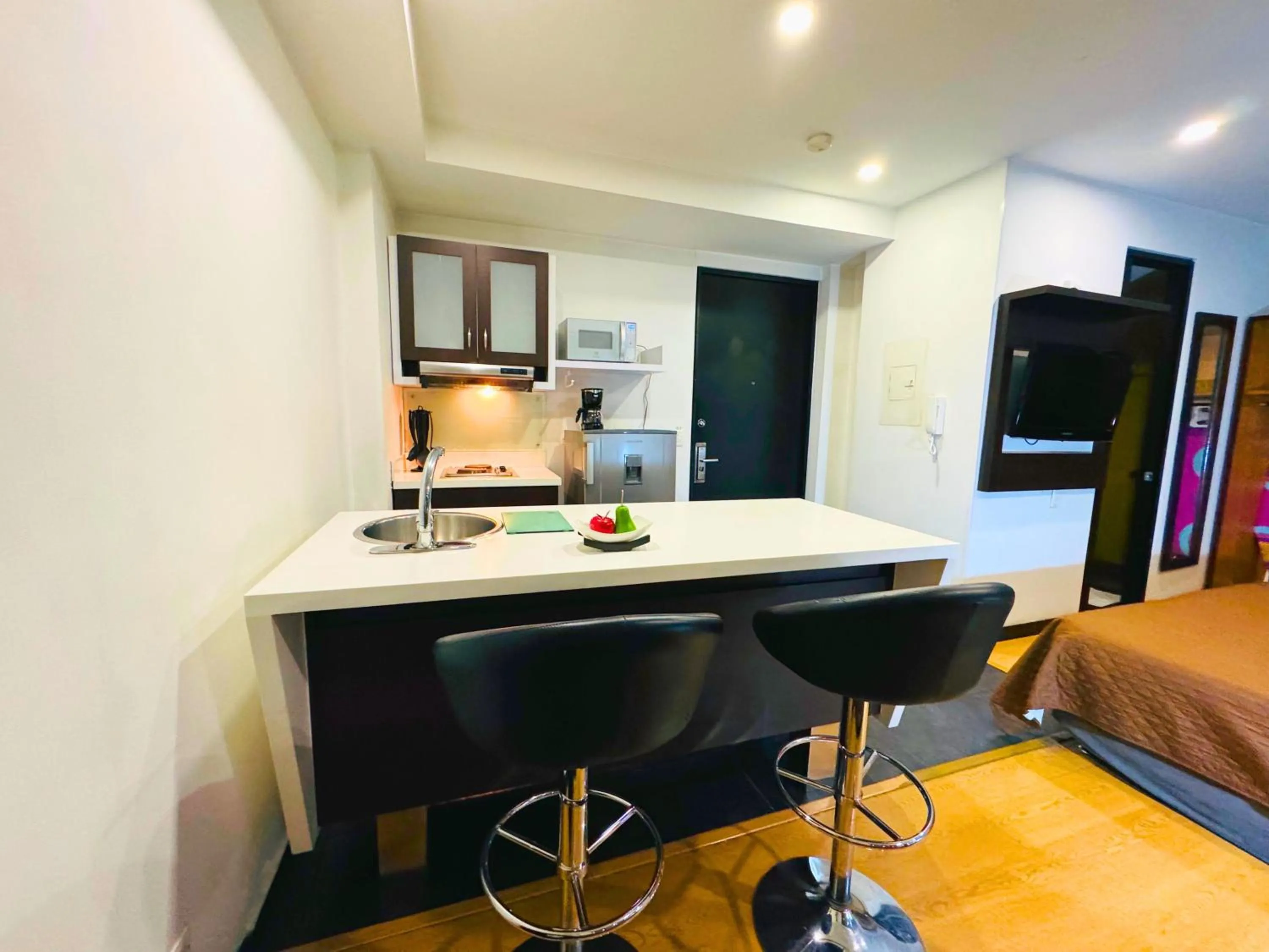 Kitchen or kitchenette, Bed in Aparta Suite Continental Bogotá