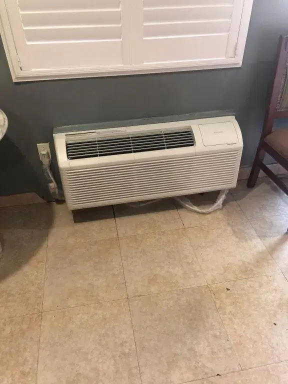 air conditioner in The Fly Inn Motel