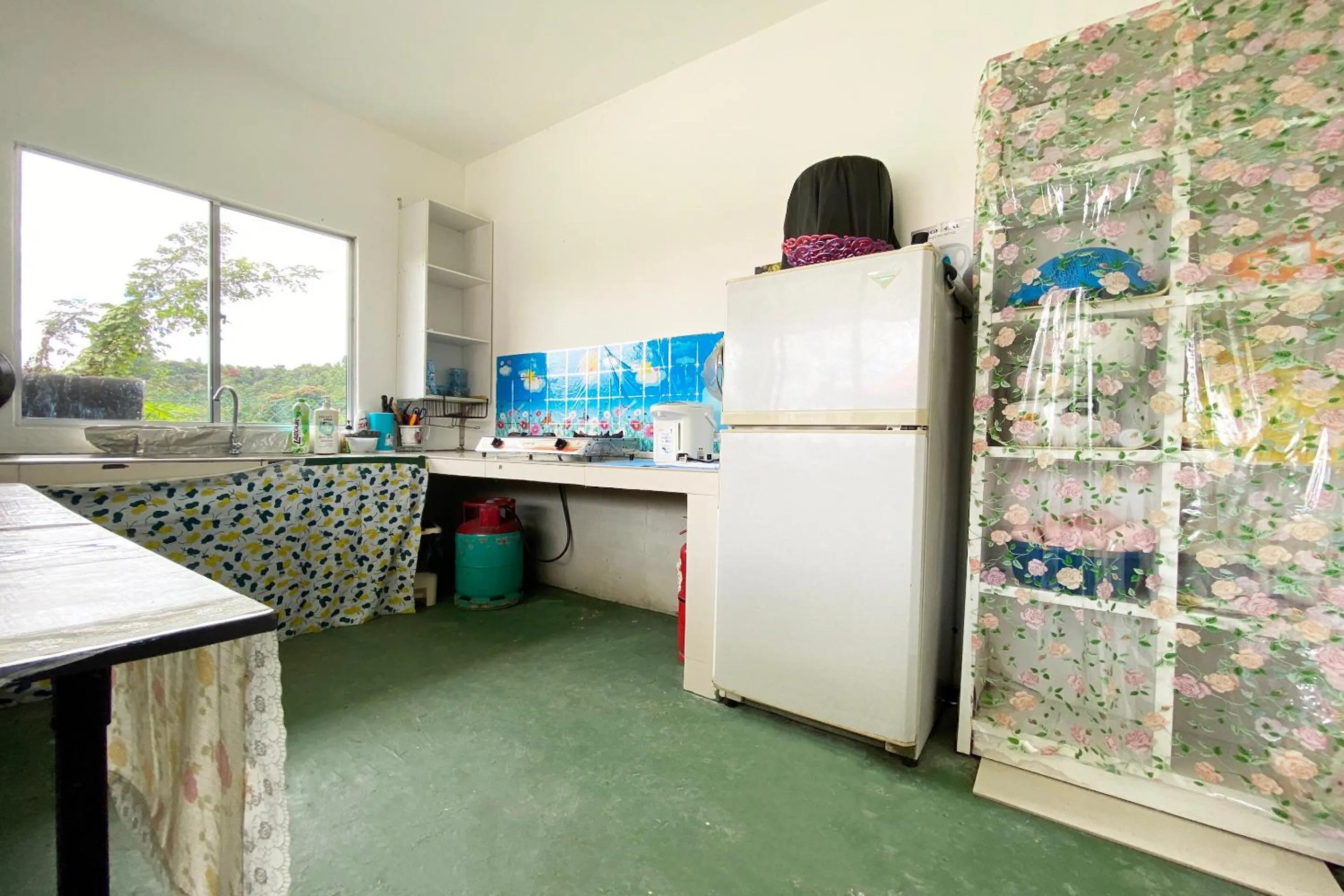 Kitchen or kitchenette in Hotel O Dh Residence