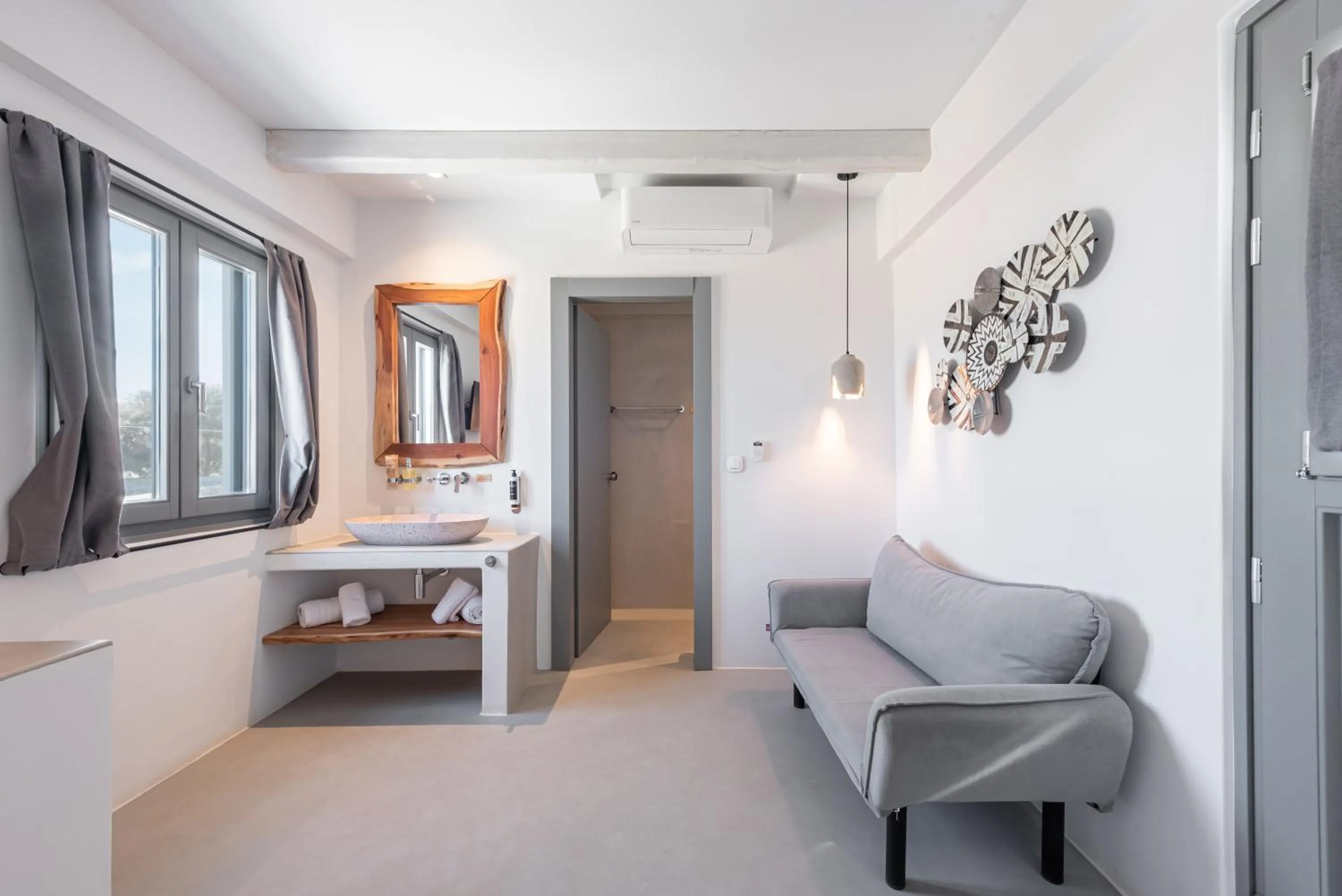 Seating area, Bed in Paros Cape Suites