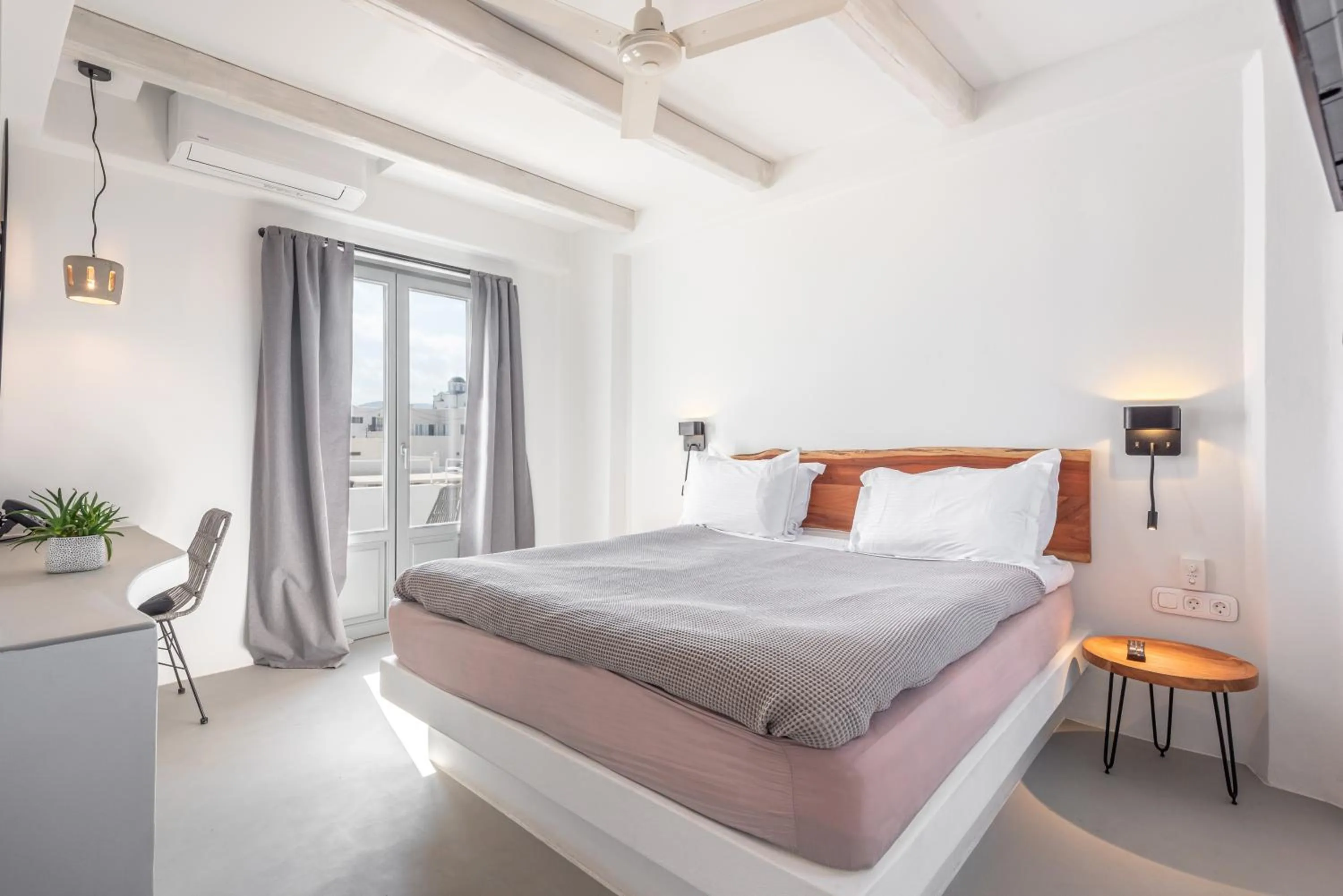 Bed in Paros Cape Suites