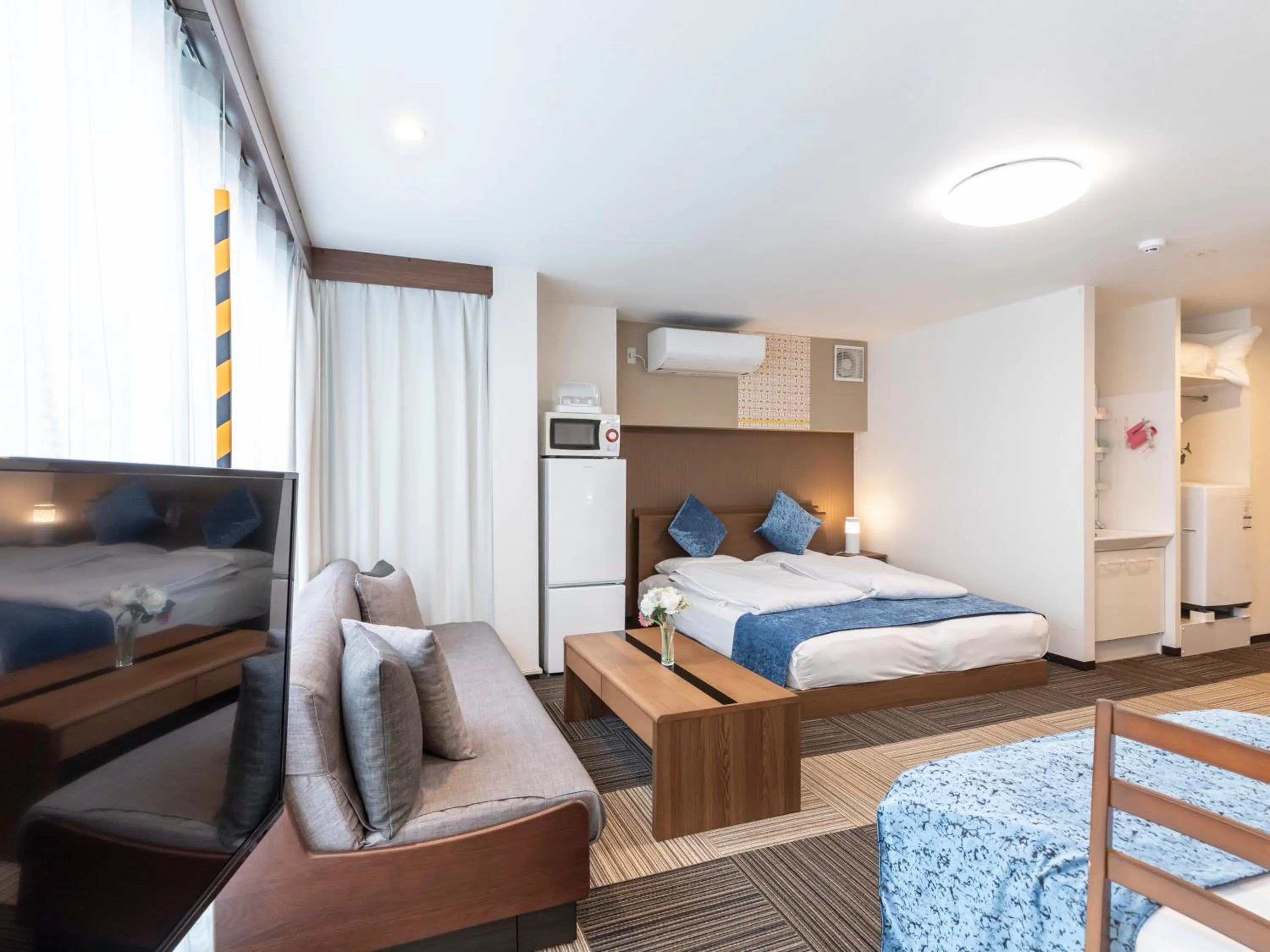 Bed in Tabist Sakuragawa River Side Hotel