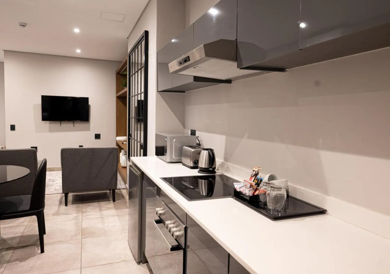 kitchen in The Catalyst Apartment Hotel by NEWMARK
