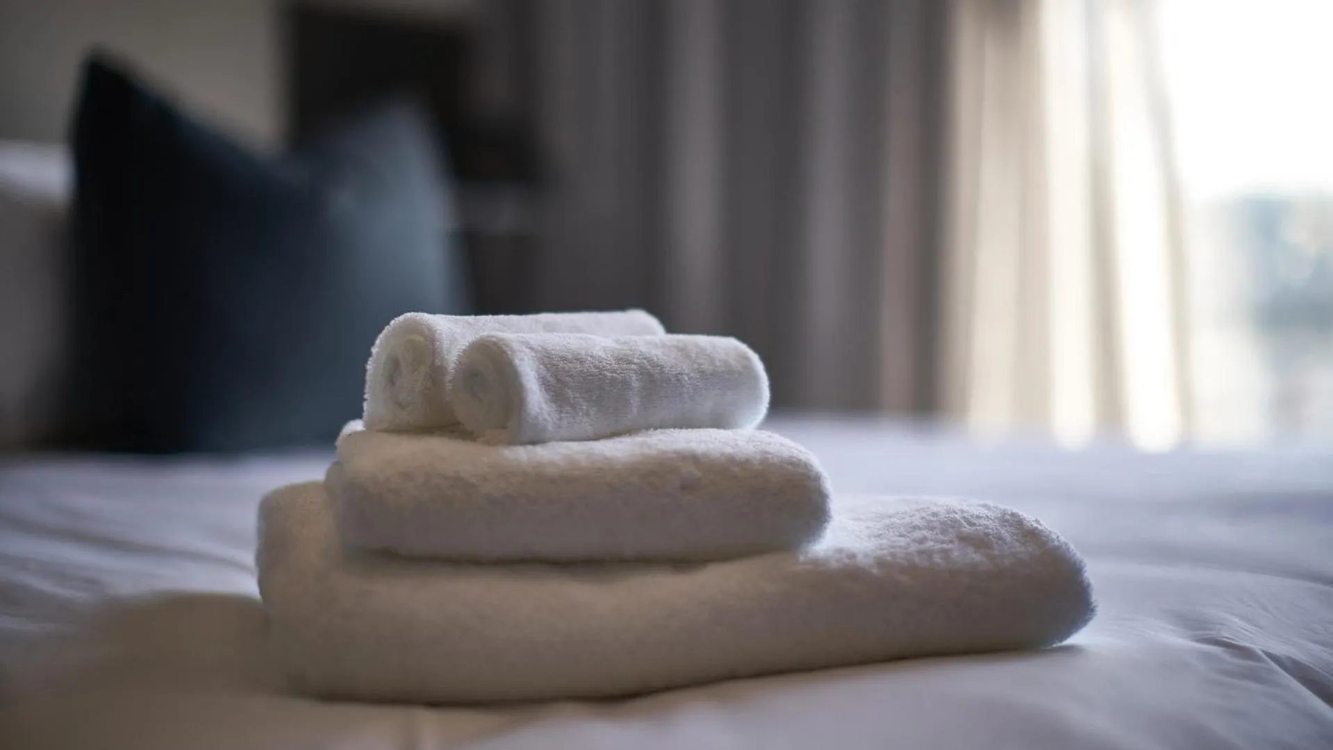 towels, Bed in The Catalyst Apartment Hotel by NEWMARK