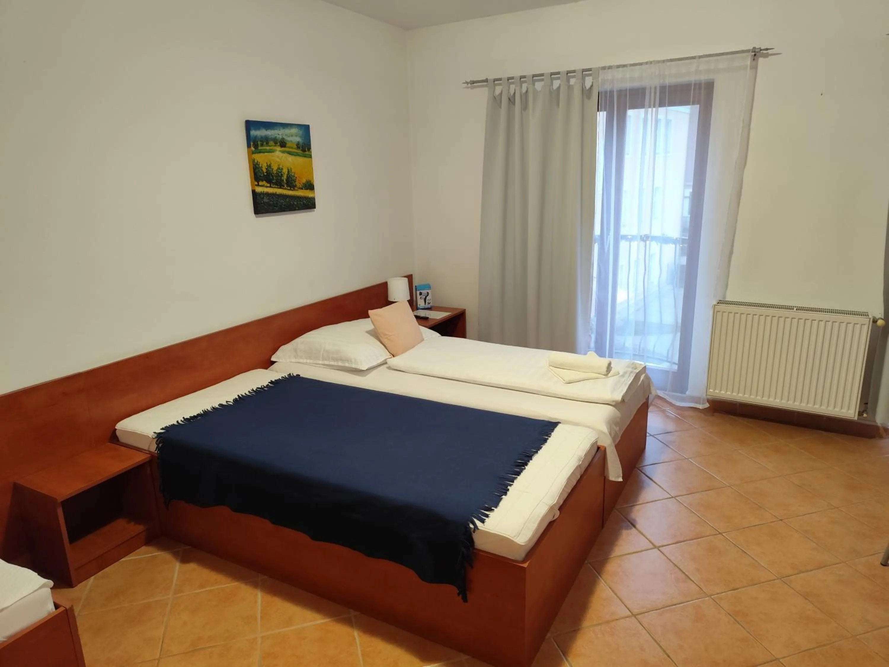 Bed in Szent Kristóf Apartmanhotel