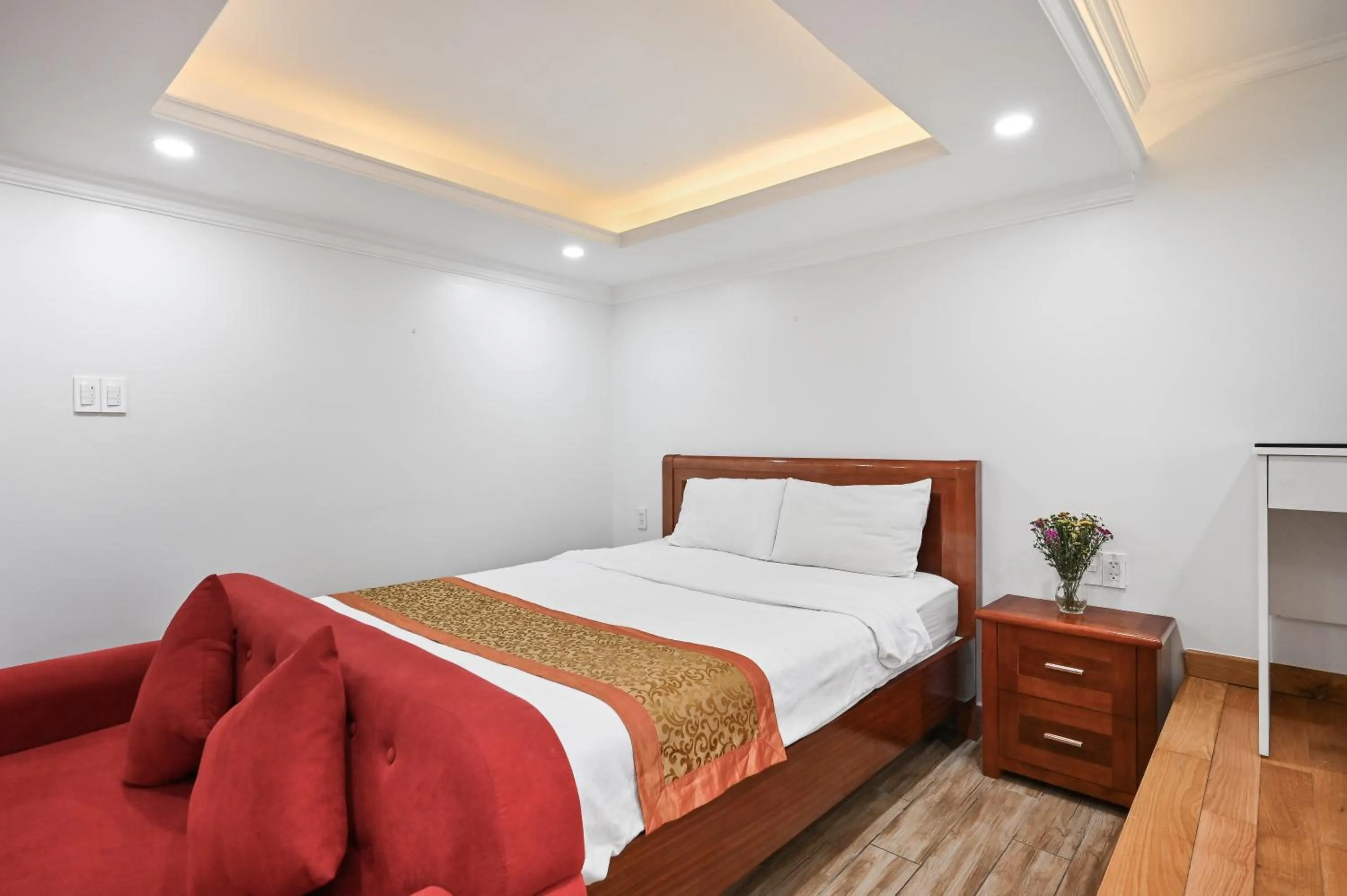 Bed in Genie Hotel & Serviced Apartments