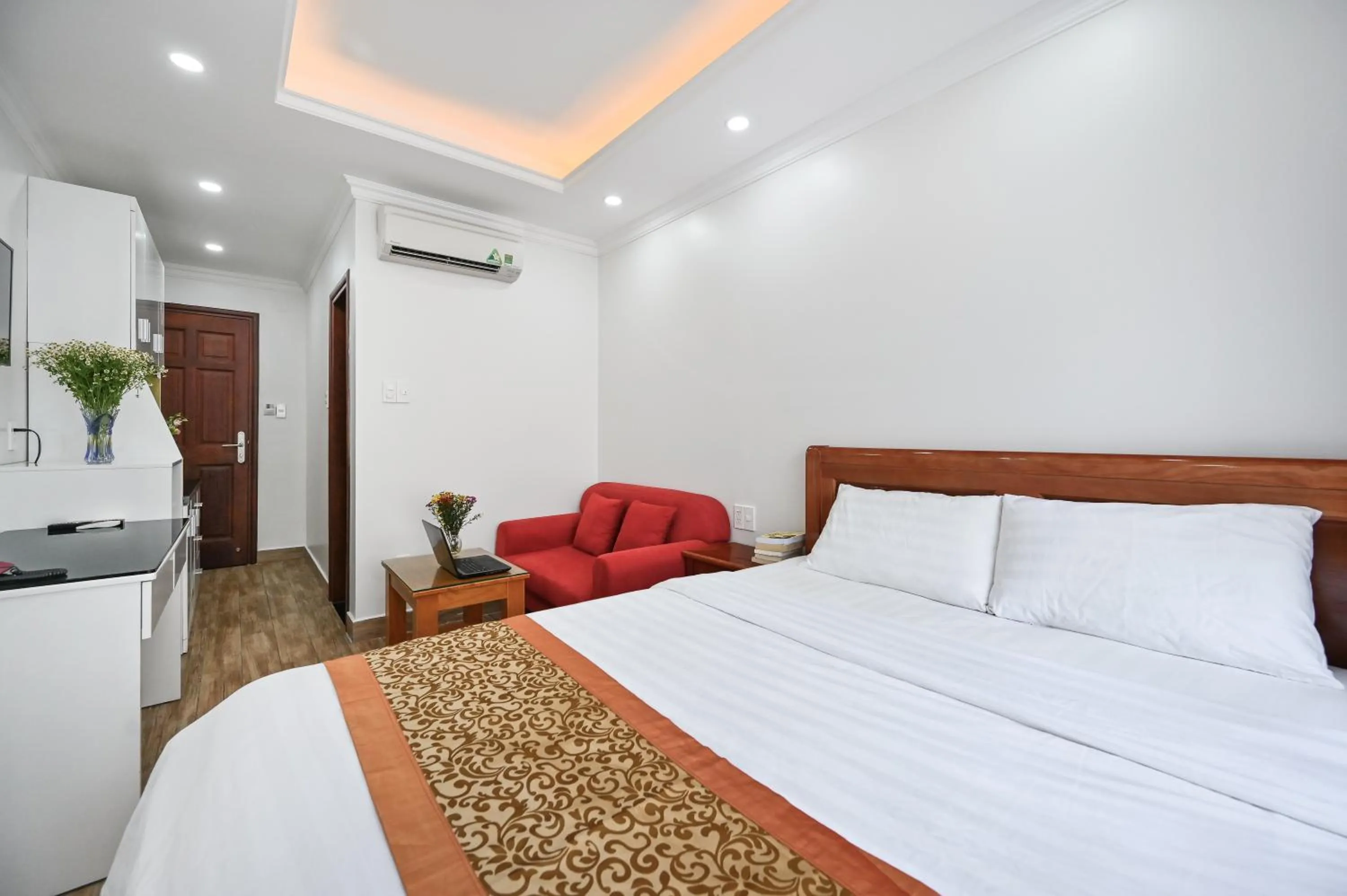 Bed in Genie Hotel & Serviced Apartments