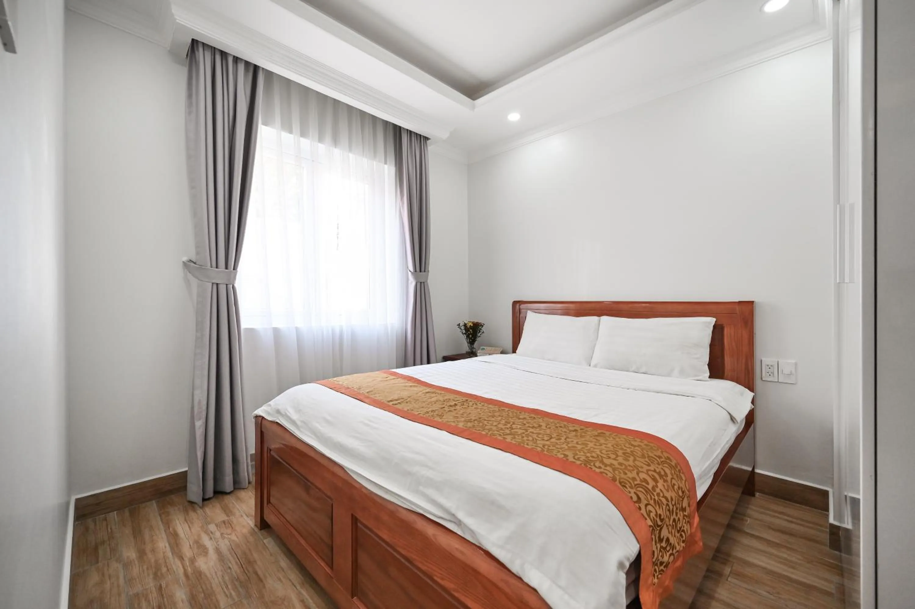 Bed in Genie Hotel & Serviced Apartments
