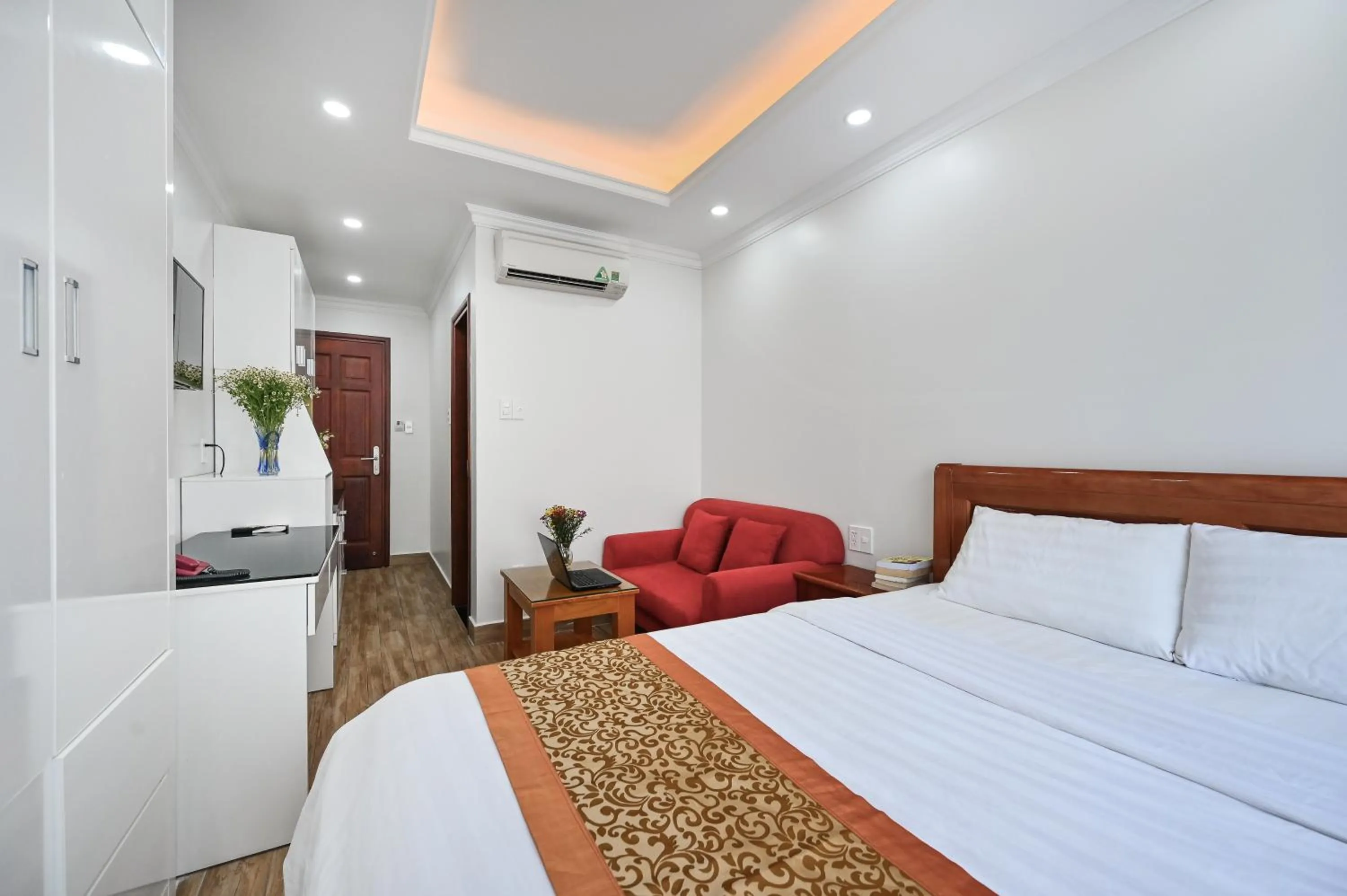 Bed in Genie Hotel & Serviced Apartments