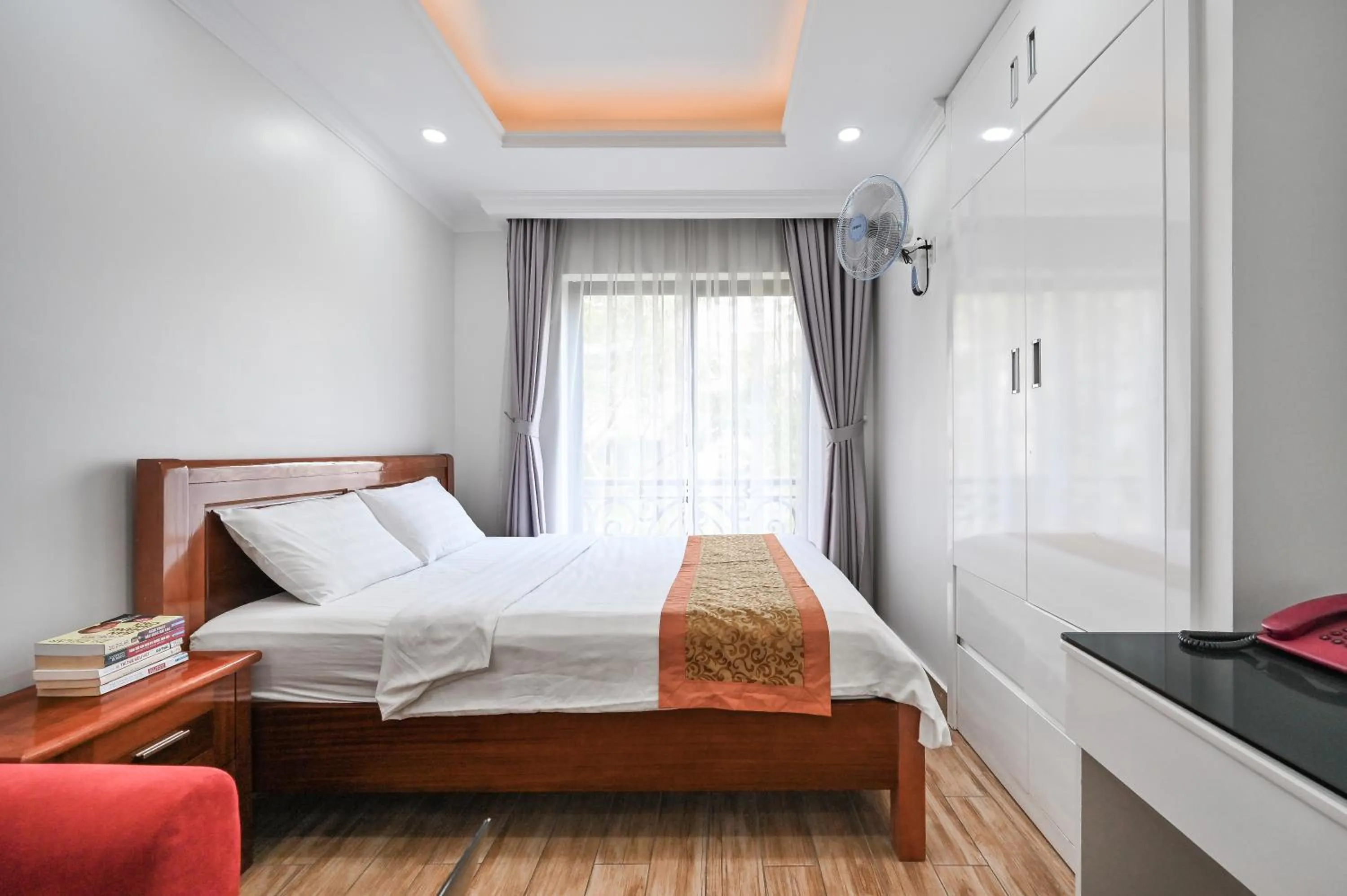 Bed in Genie Hotel & Serviced Apartments