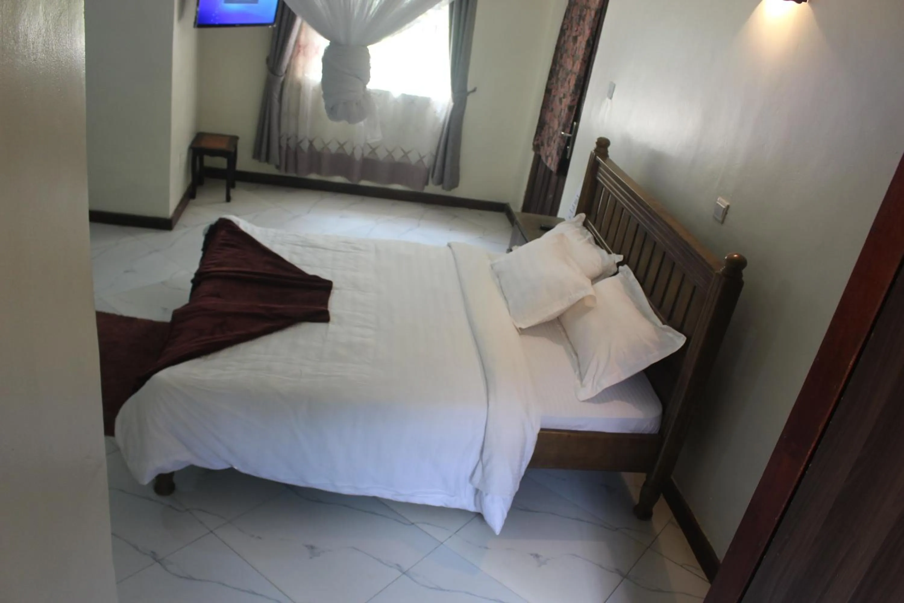 Bed in Montane Safaris Hotel