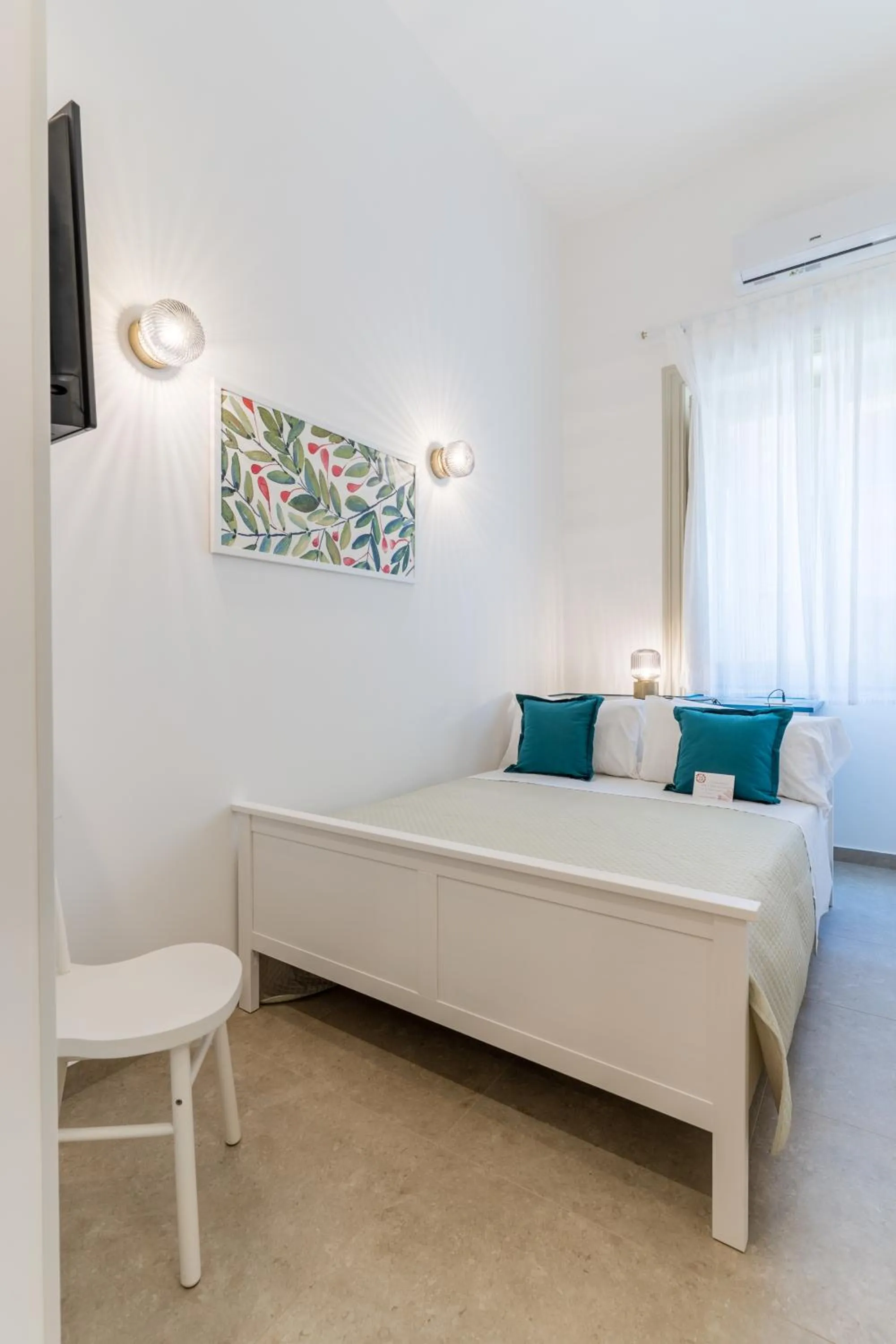 Bed in Mama Tita Rooms and Breakfast