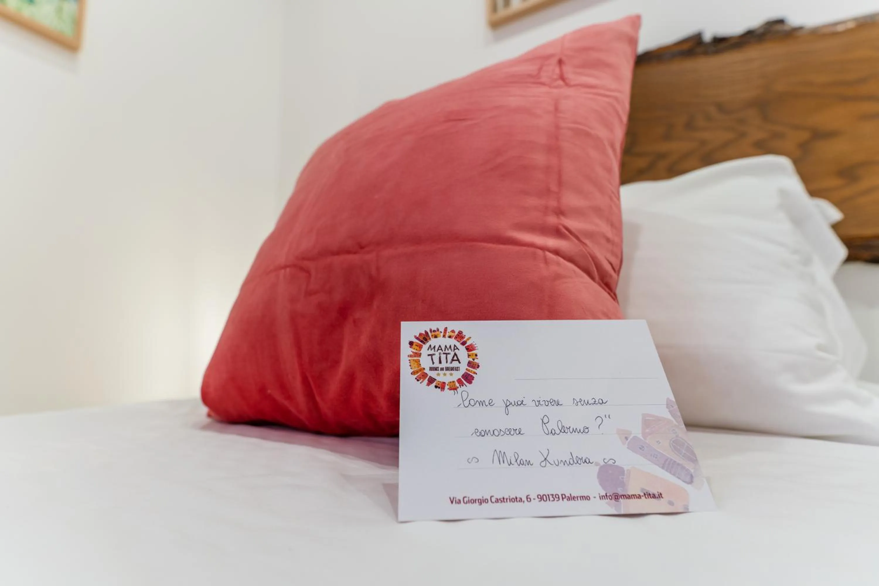 Bed in Mama Tita Rooms and Breakfast