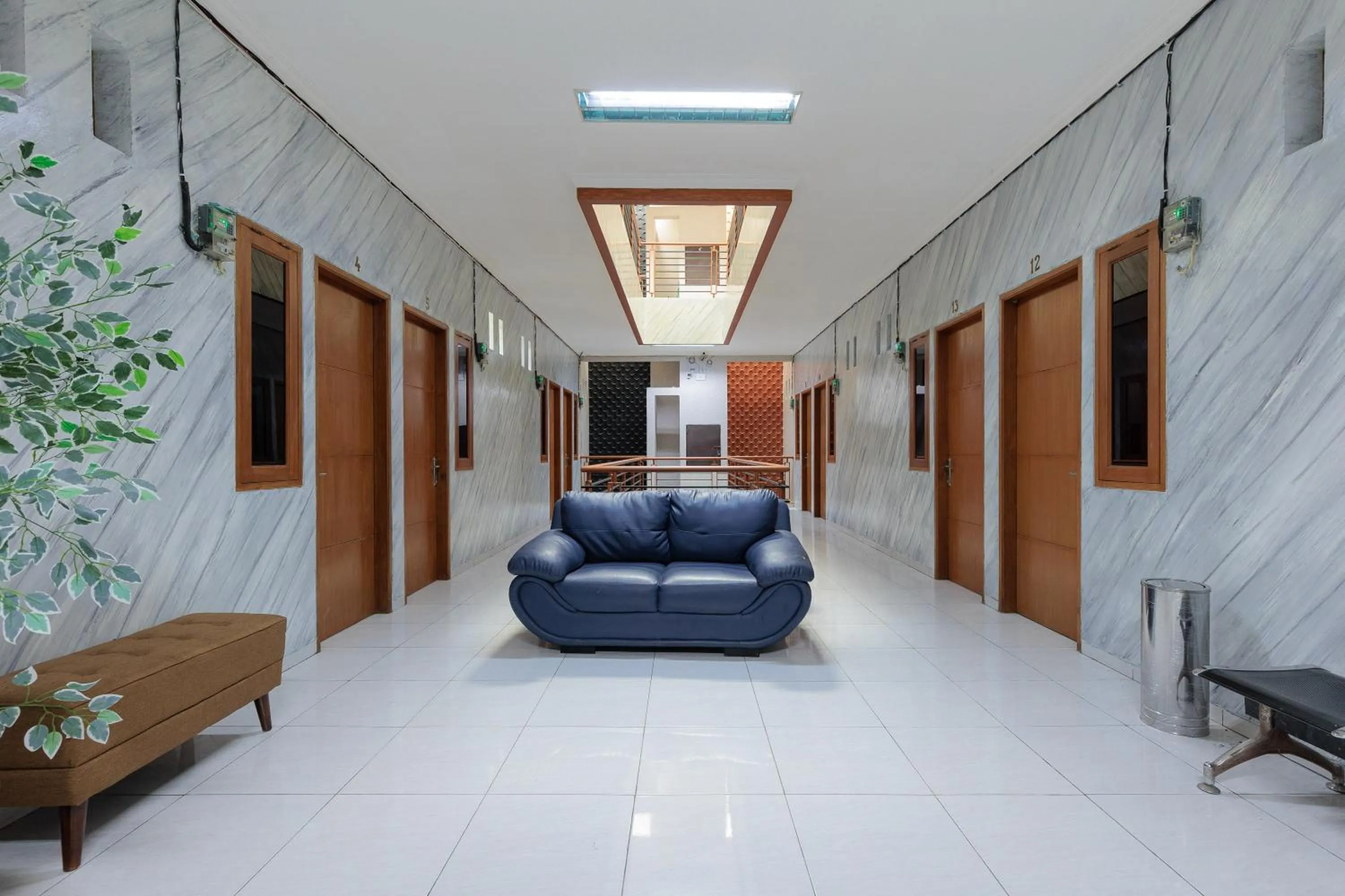 Seating area in RedDoorz Syariah at Hotel Tiga ER near Karawang Central Plaza