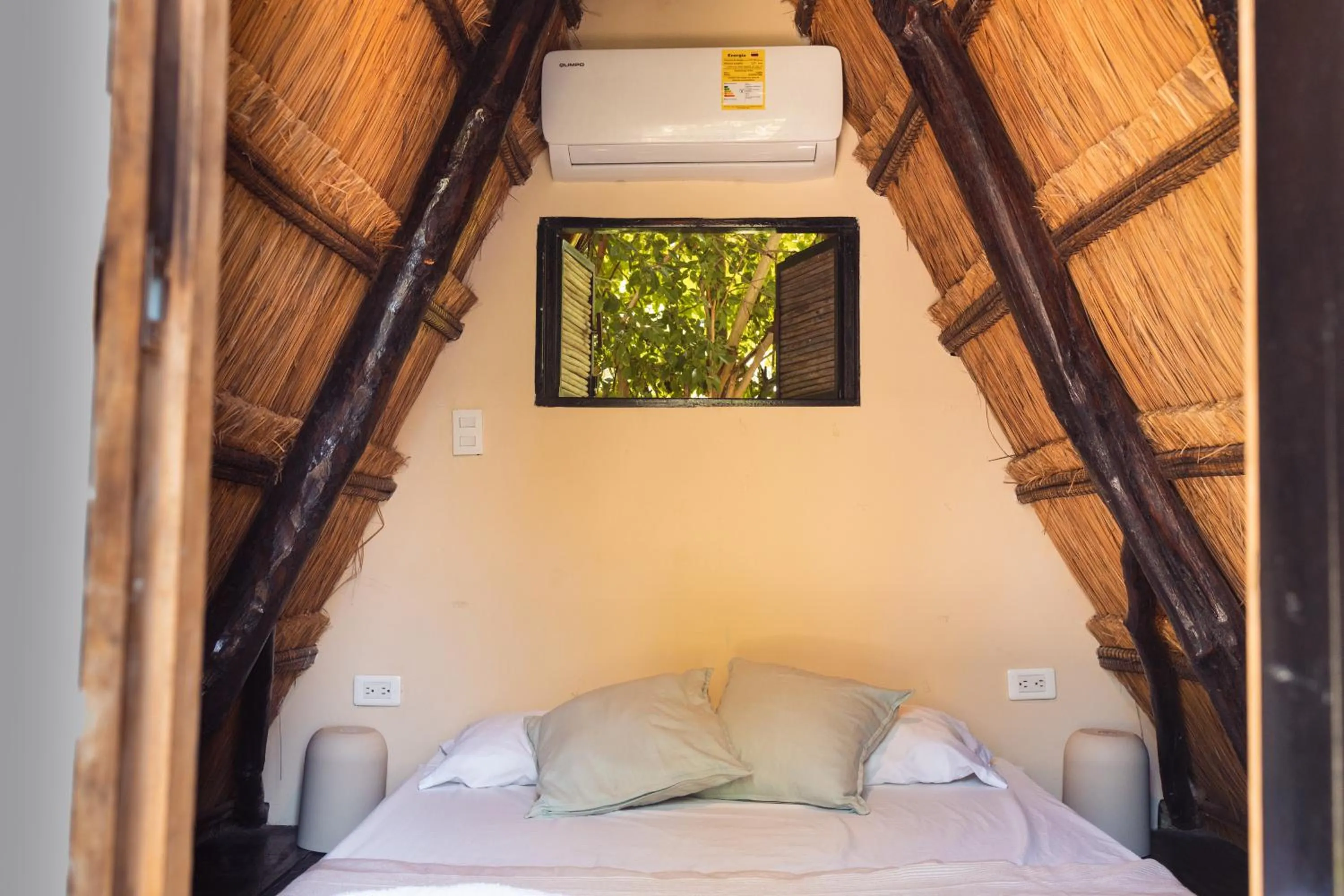 Bed in AMALIFE Beach Club & Hotel