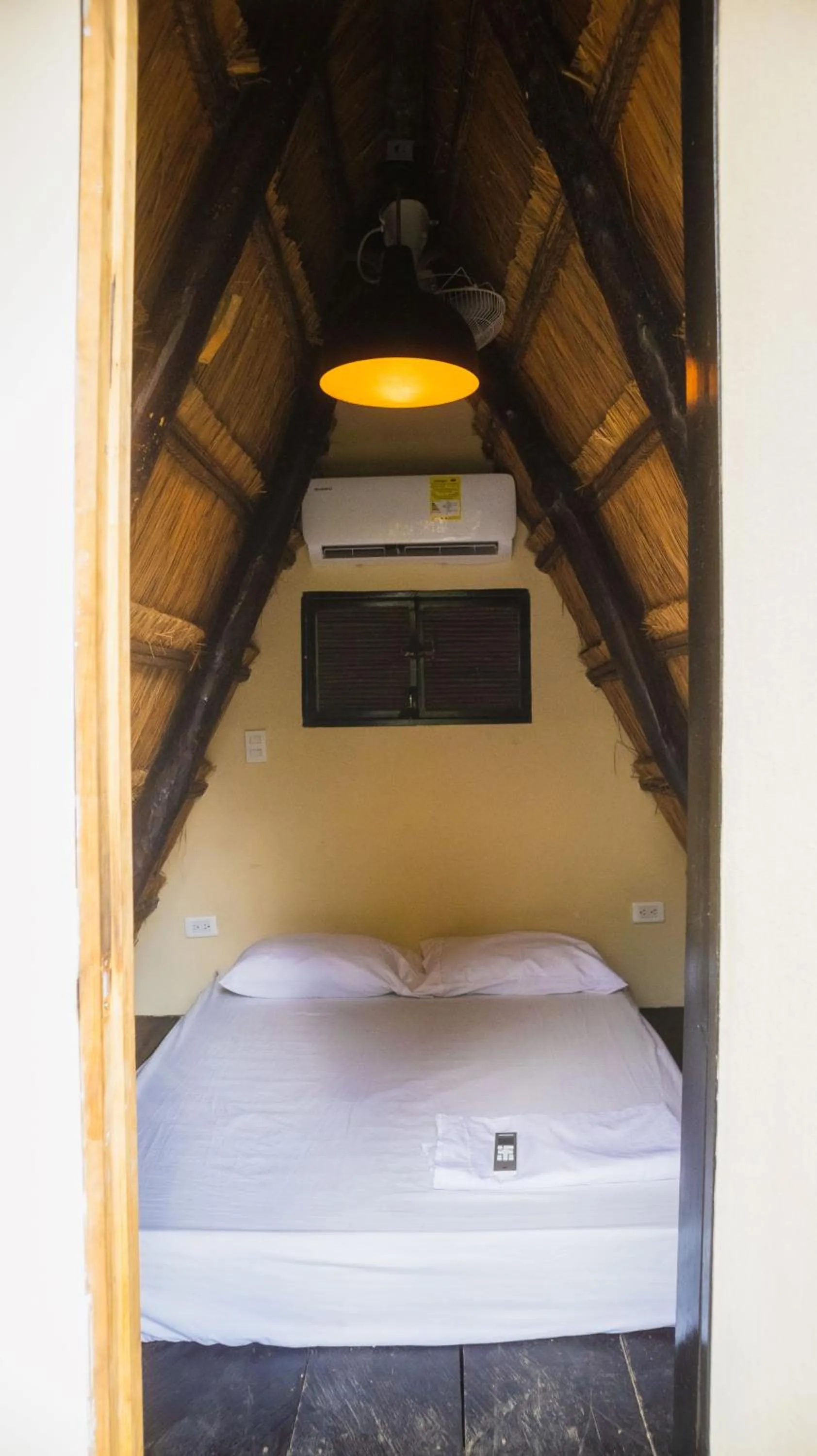 Bed in AMALIFE Beach Club & Hotel