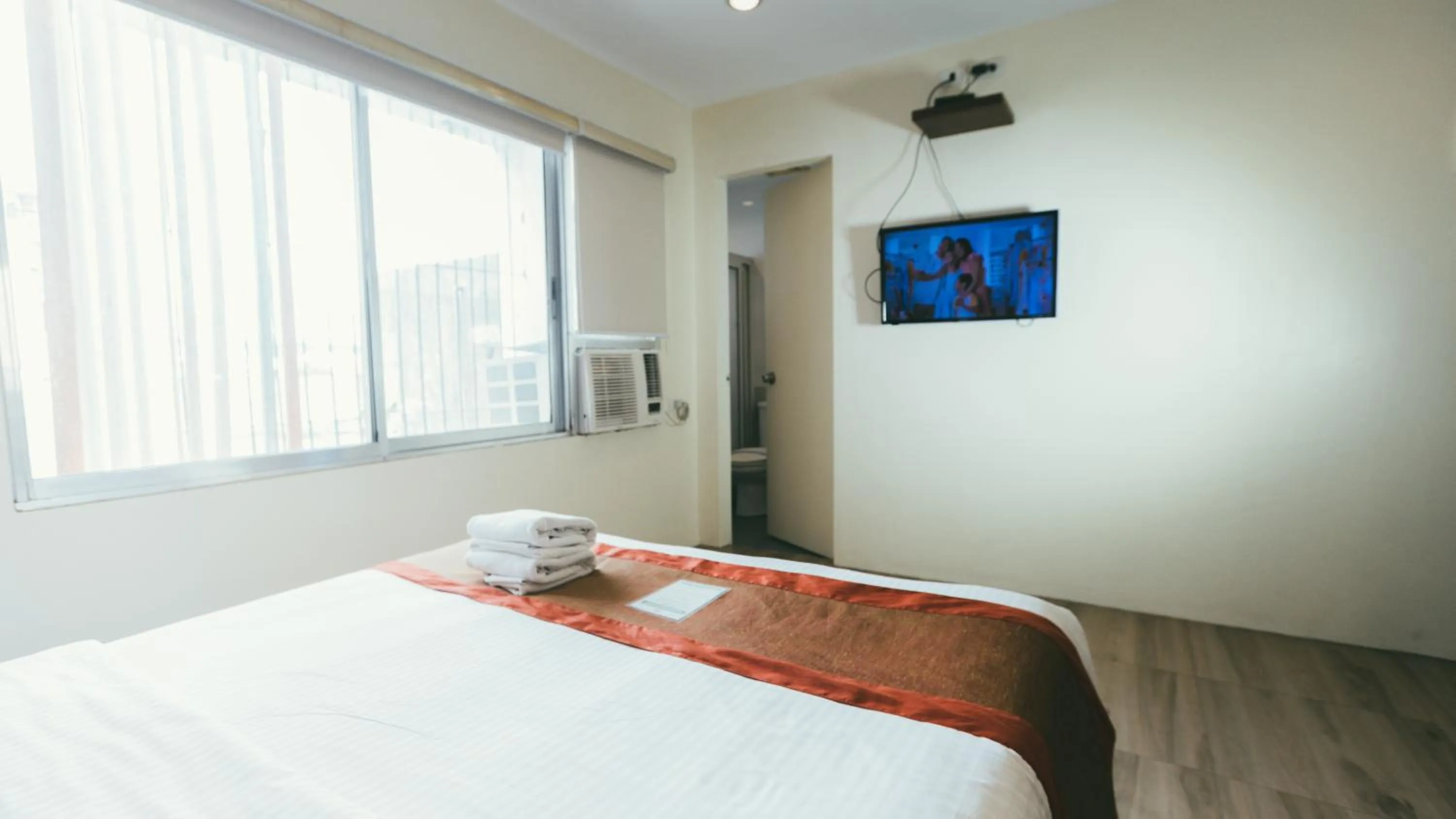 Bed in NS Royal Hotel