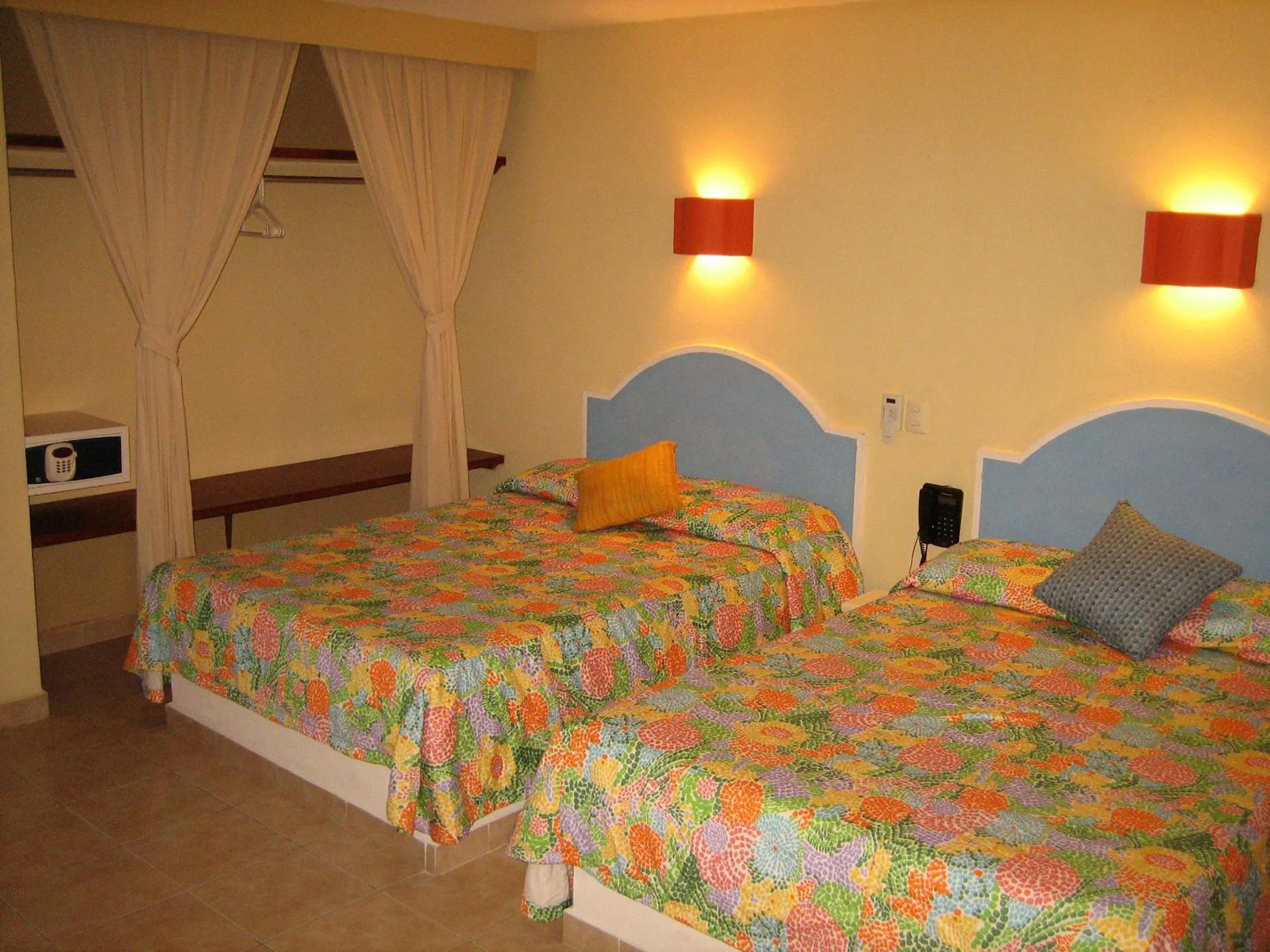 Bed in Hotel Delfines Acapulco by NG Hoteles