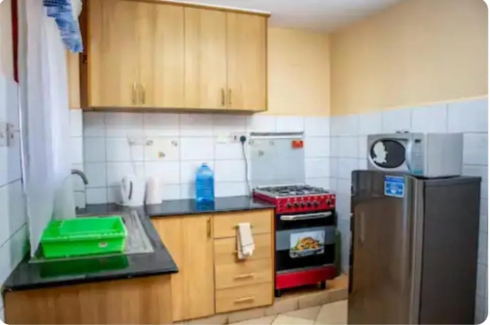 Kitchen or kitchenette in Lux Suites Makao Rossyln Apartments