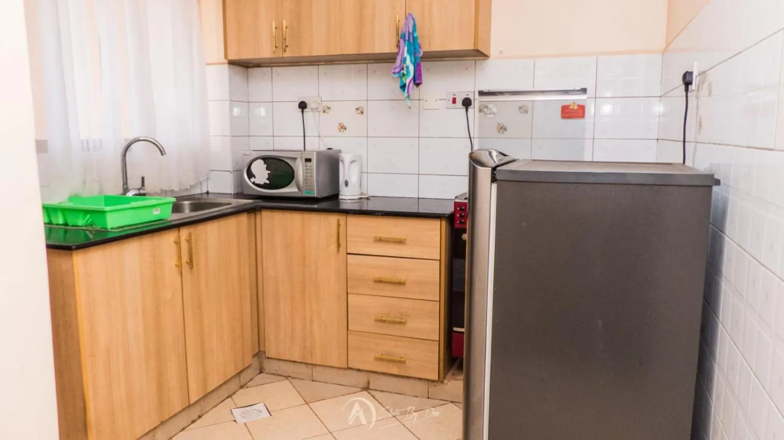 Kitchen or kitchenette in Lux Suites Makao Rossyln Apartments