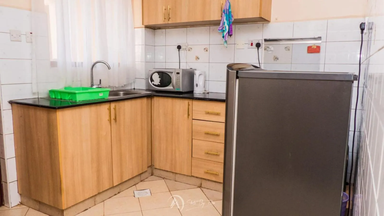 Kitchen or kitchenette in Lux Suites Makao Rossyln Apartments