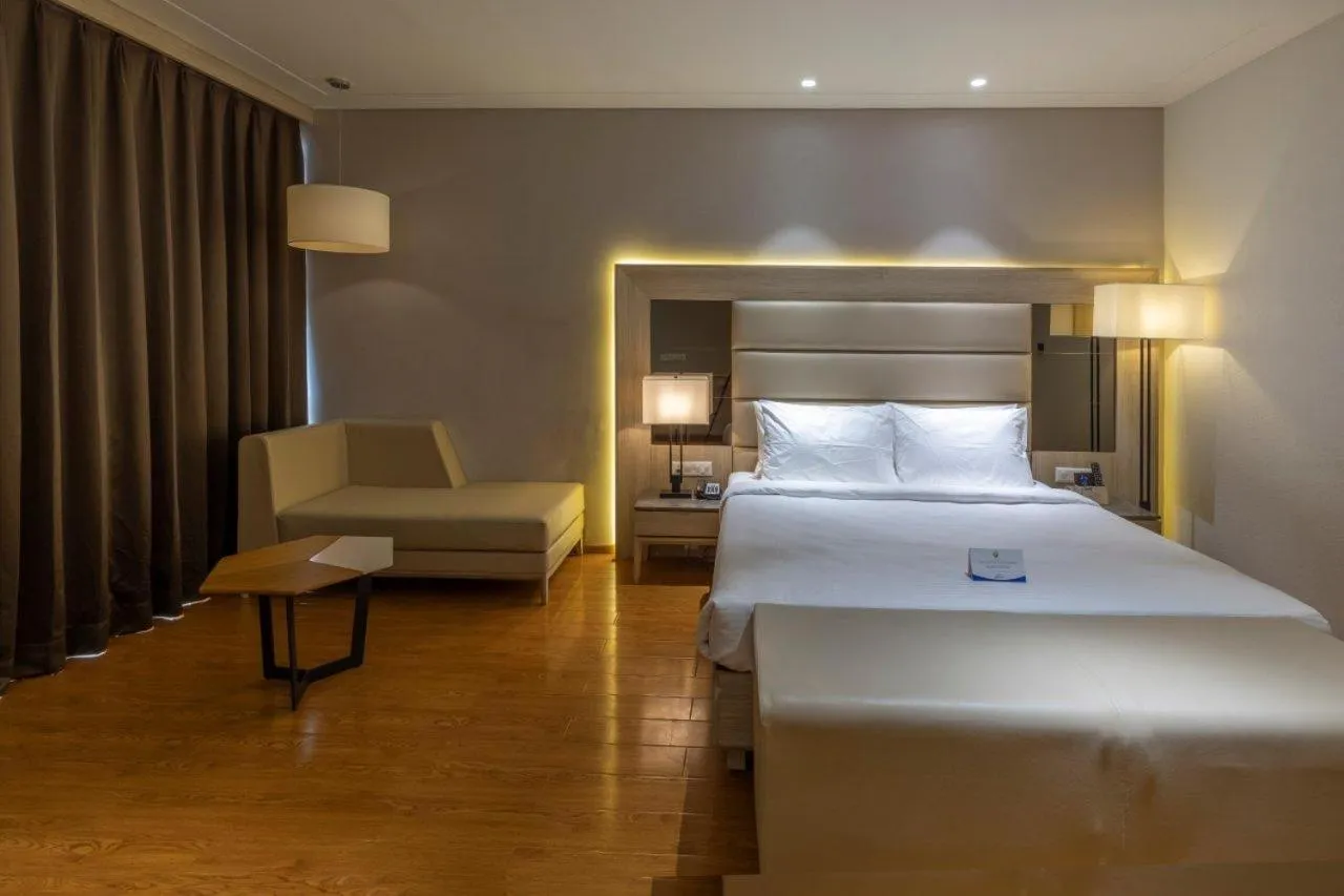 Bedroom in Sarovar Portico Morbi