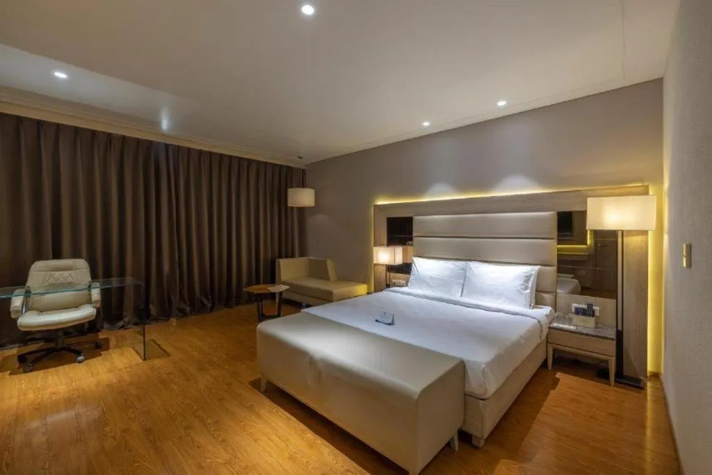 Bed in Sarovar Portico Morbi