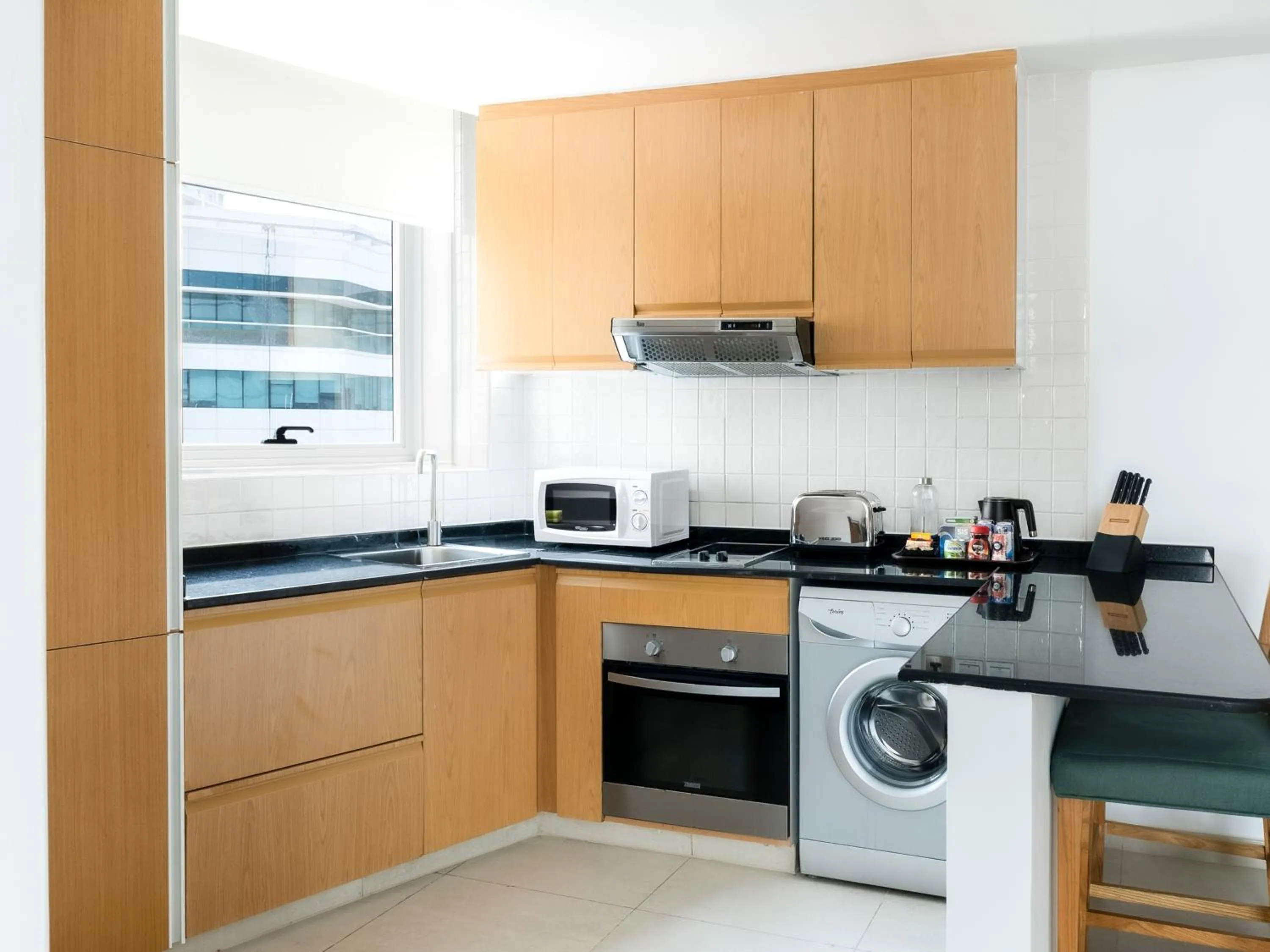 Kitchen or kitchenette in Grand Heights Dubai Hotel Apartments