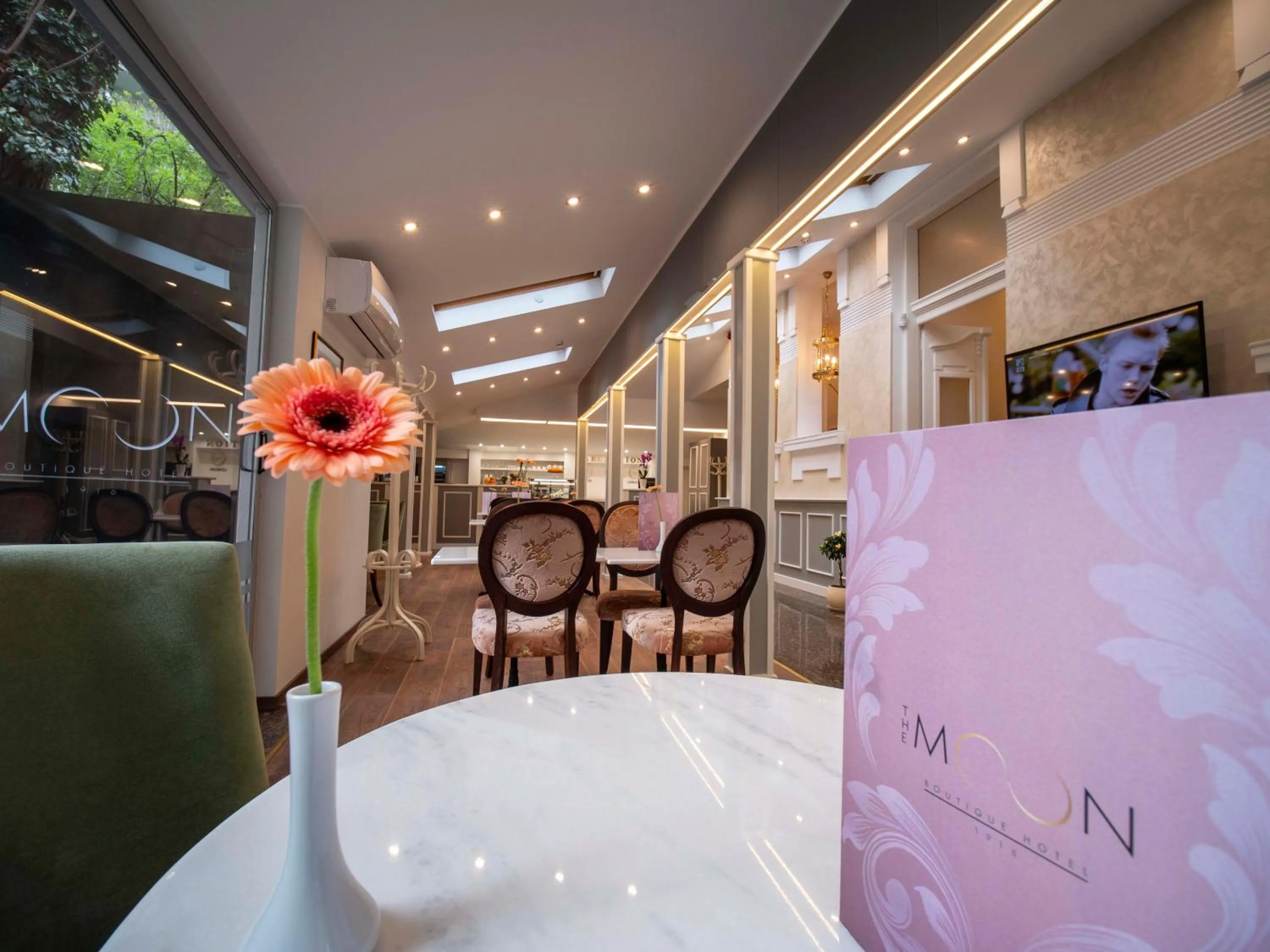 Communal lounge/ TV room in The Moon Boutique Hotel