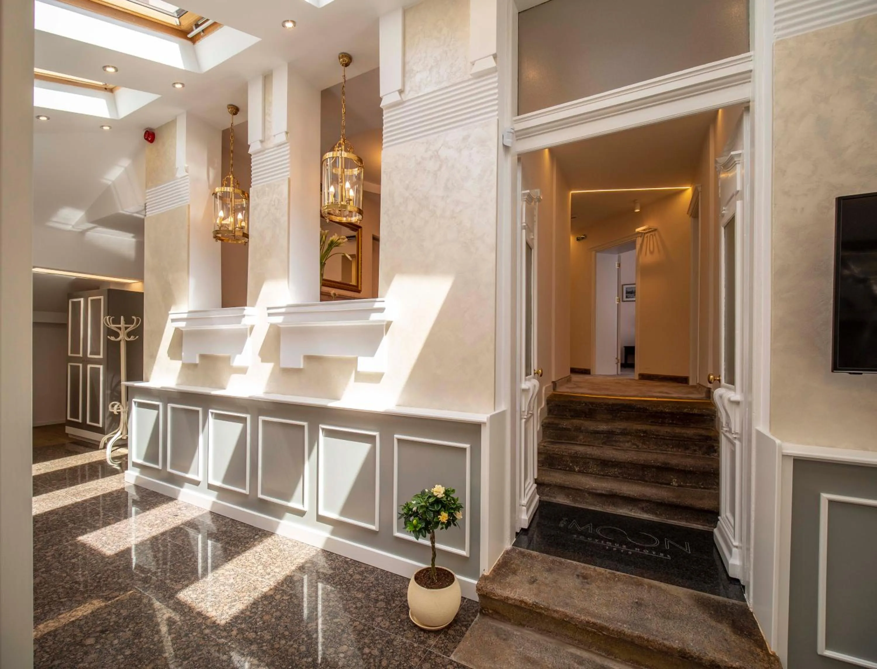 Communal lounge/ TV room in The Moon Boutique Hotel