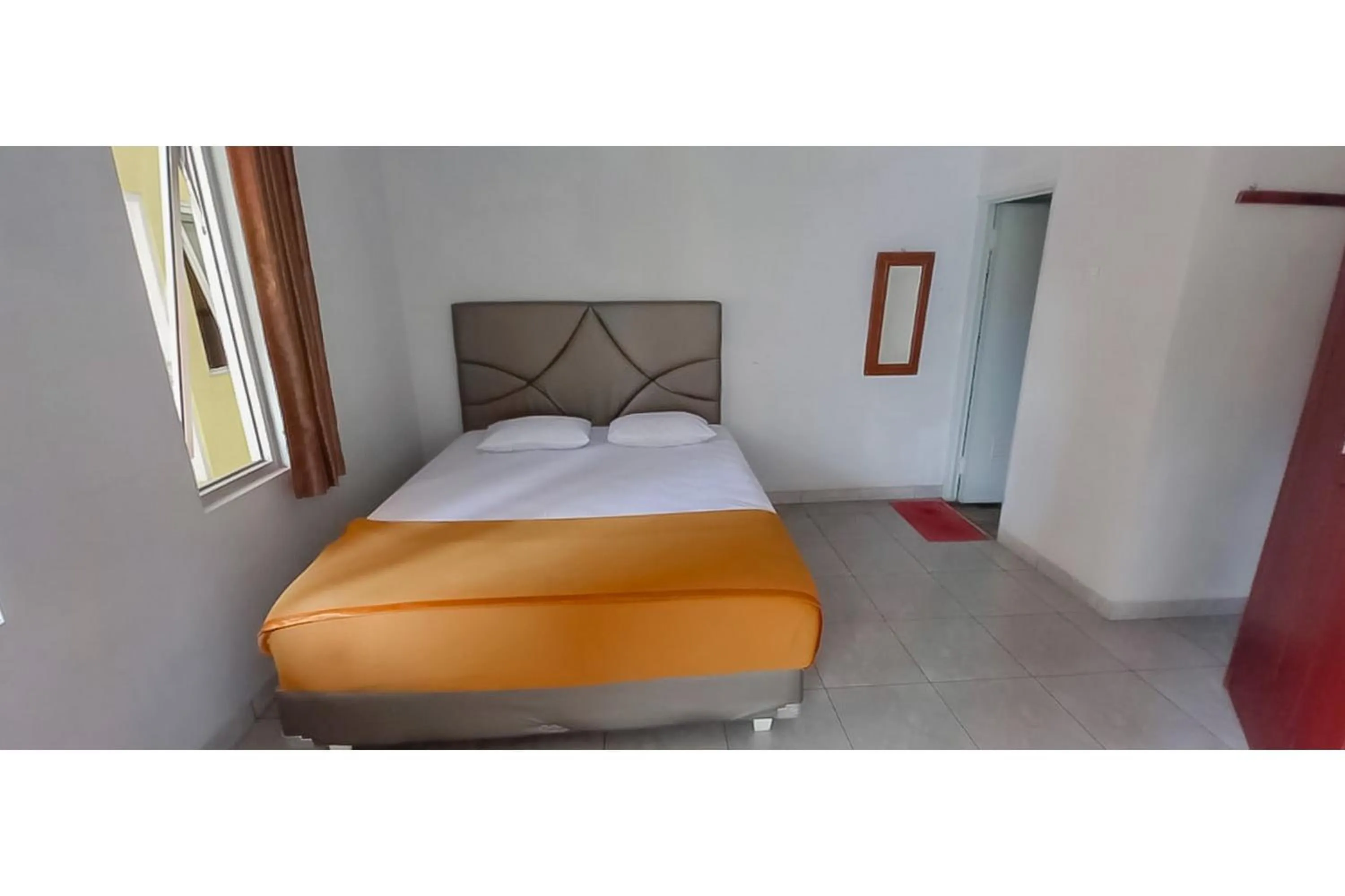 Bed in Hotel Sri Indrawati Puncak Mitra RedDoorz