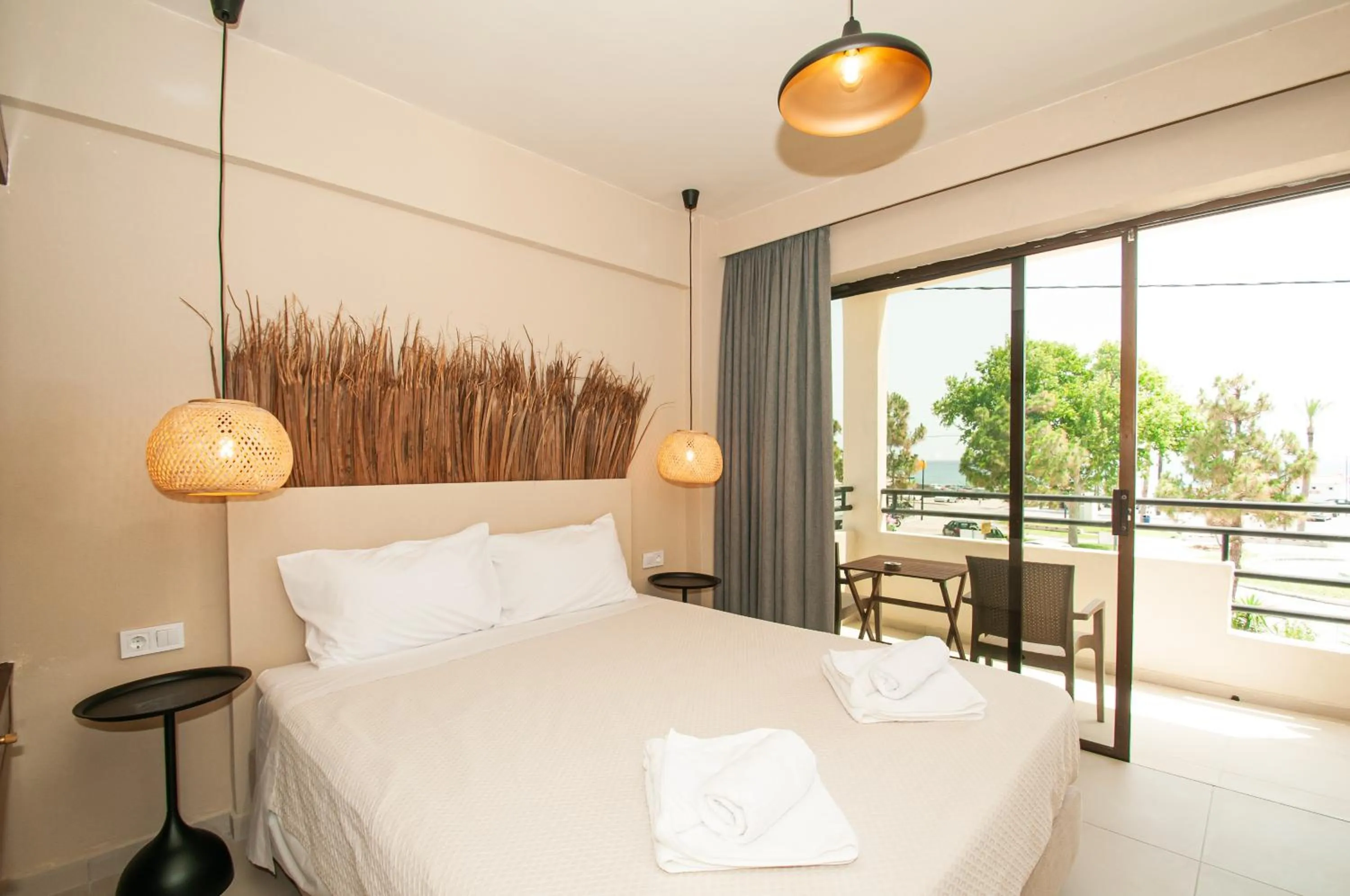 Bed in Atma Beach Rooms & Suites