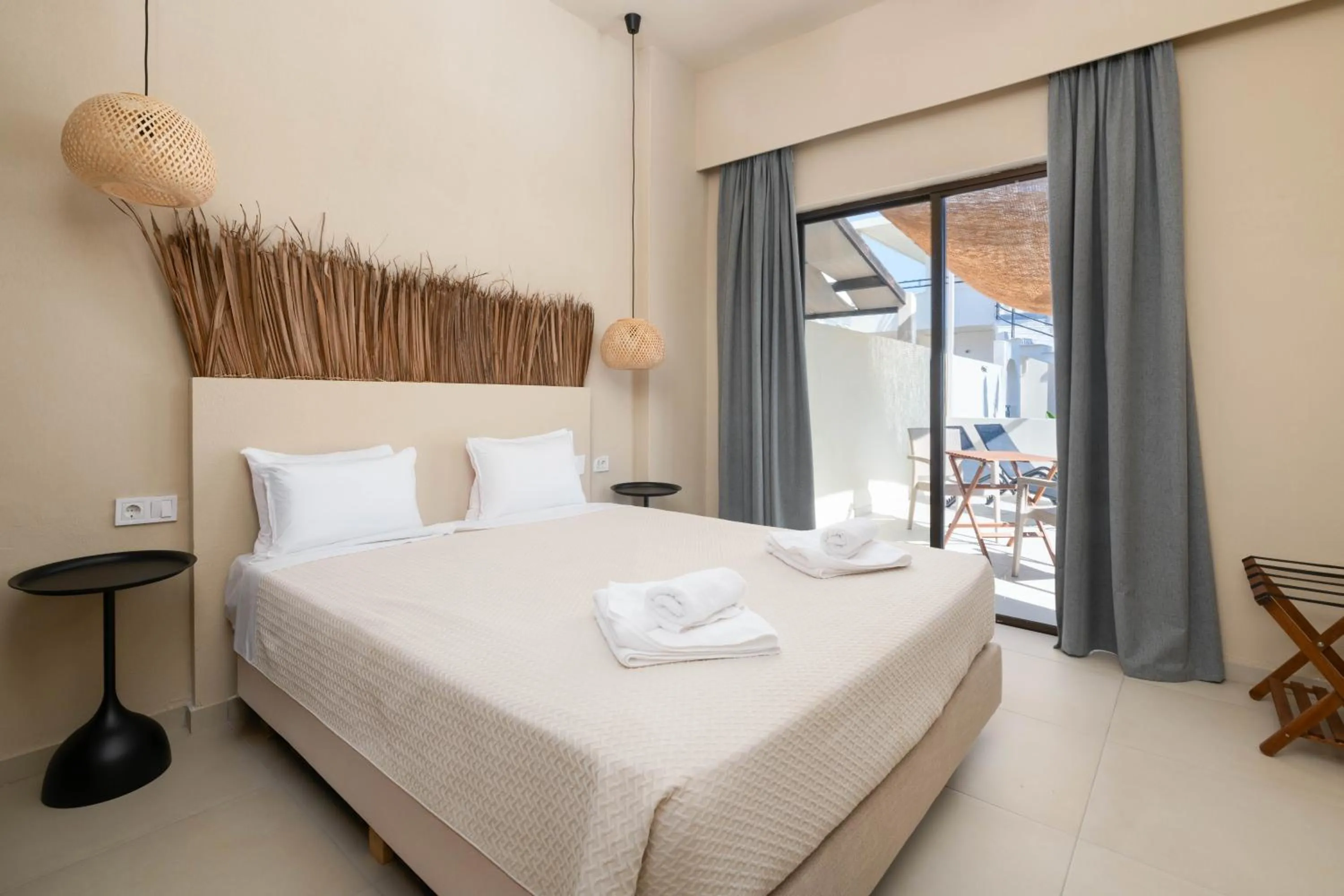 Bed in Atma Beach Rooms & Suites