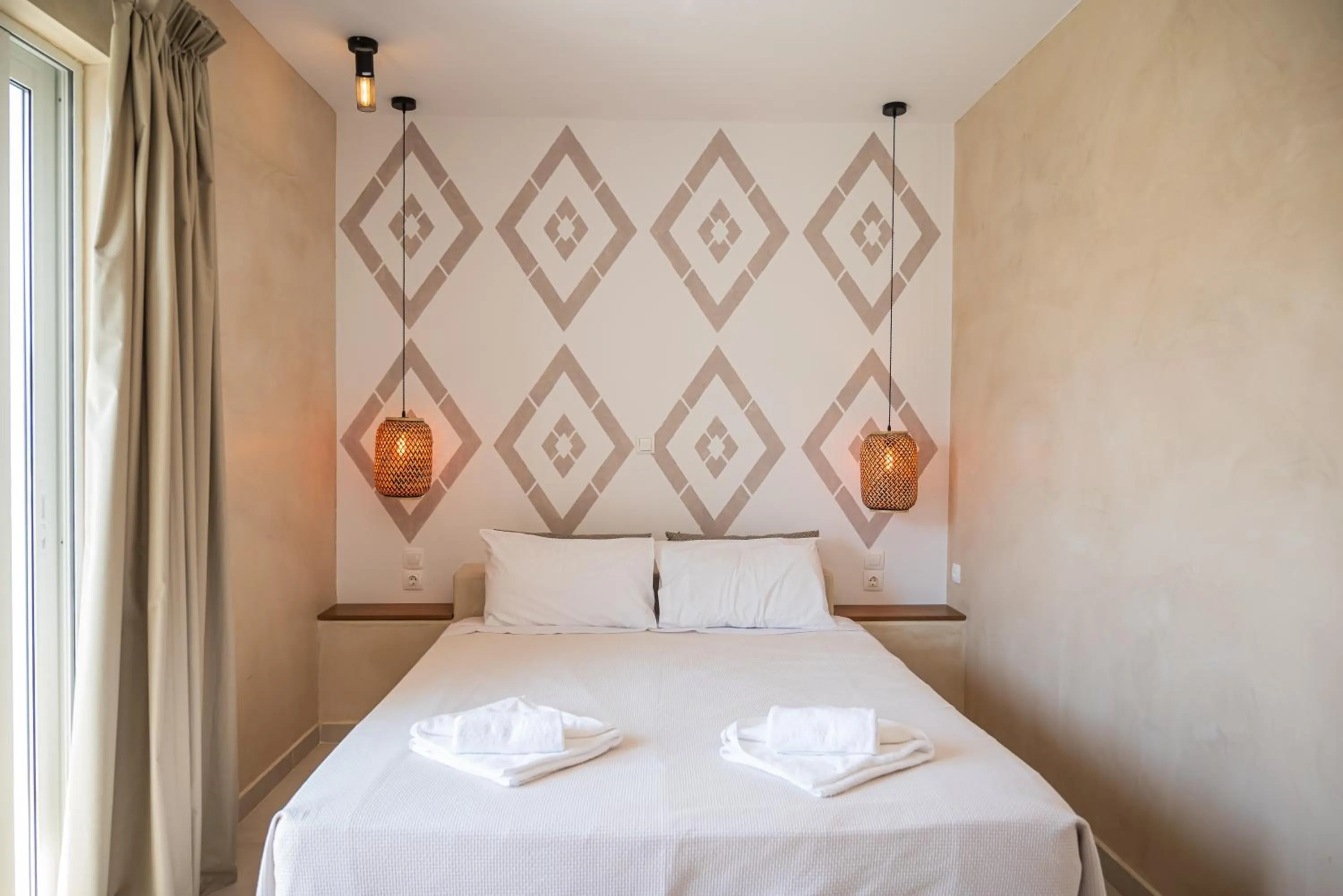 Bed in Atma Beach Rooms & Suites