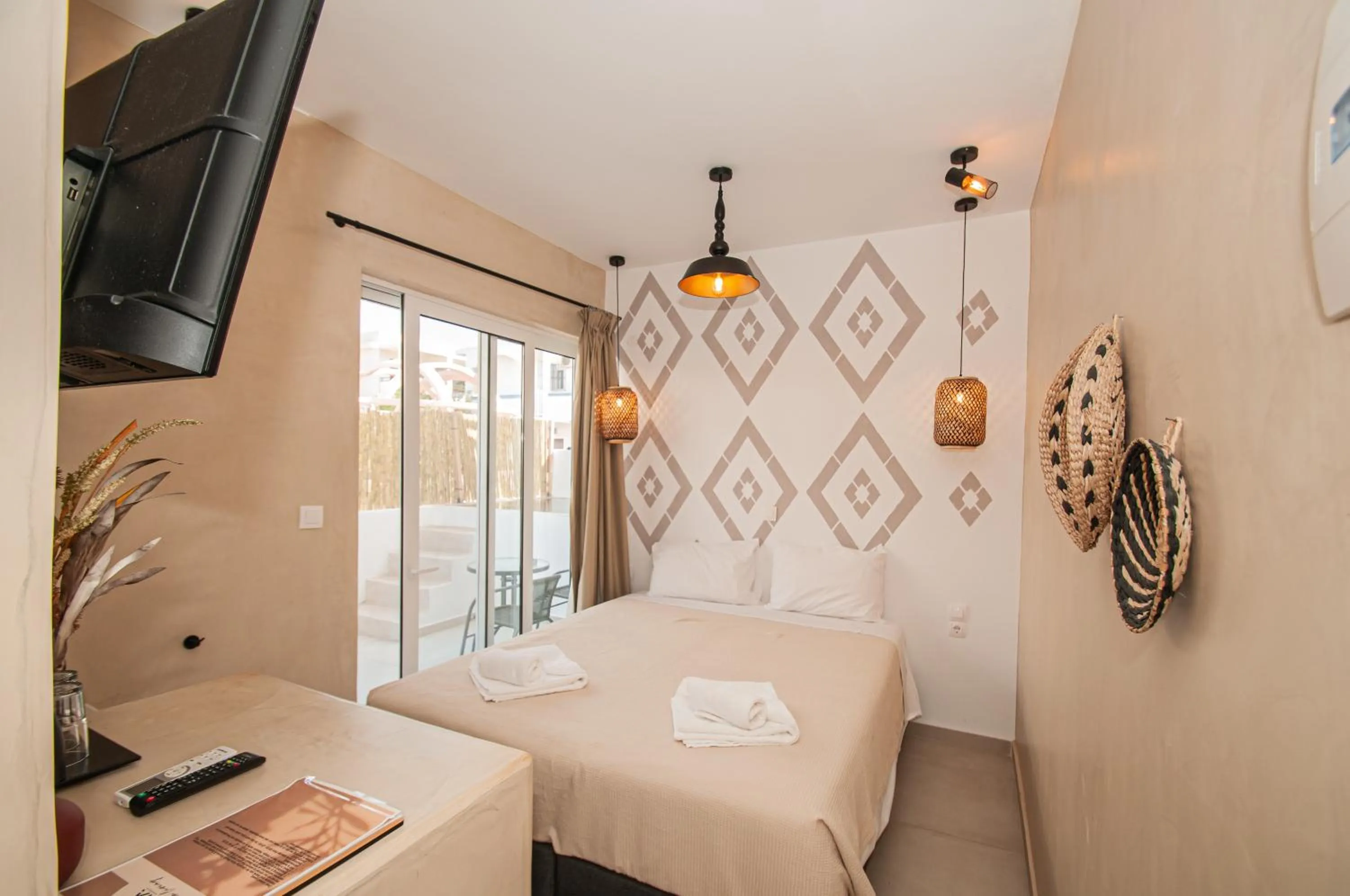 Bed in Atma Beach Rooms & Suites