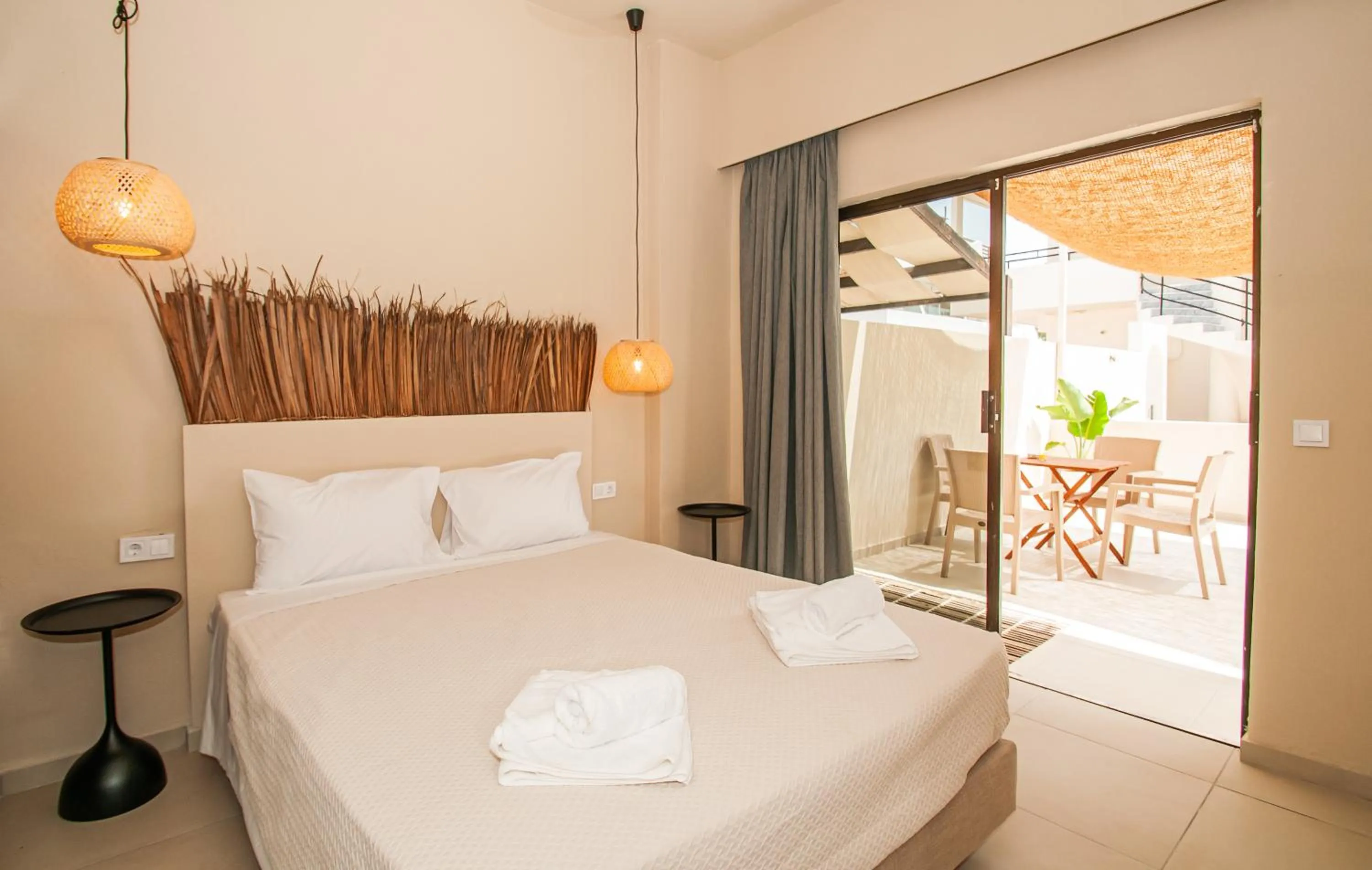 Bed in Atma Beach Rooms & Suites