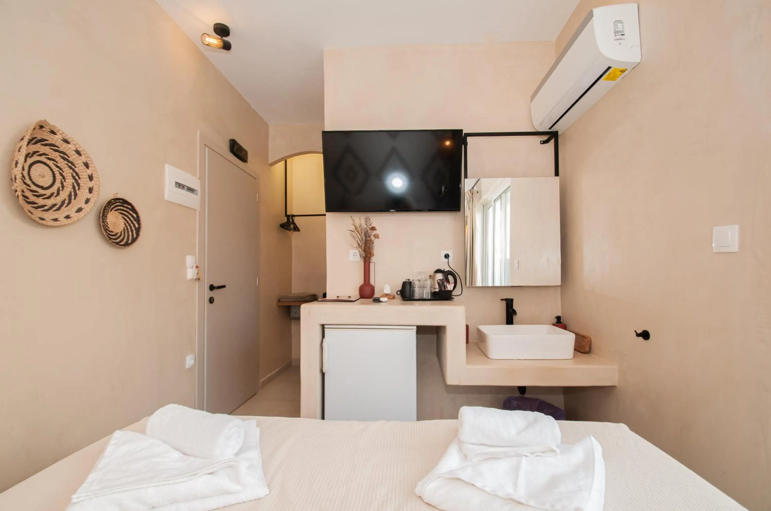 Bed in Atma Beach Rooms & Suites