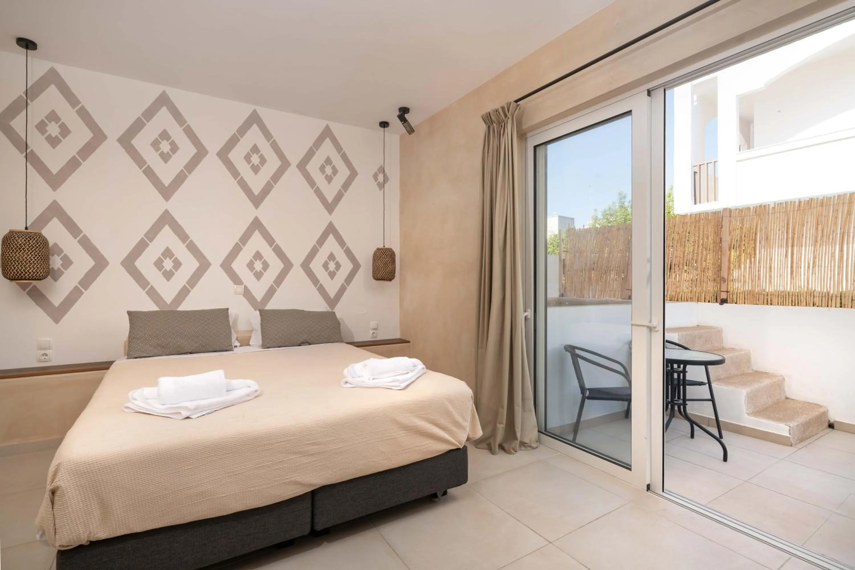 Bed in Atma Beach Rooms & Suites