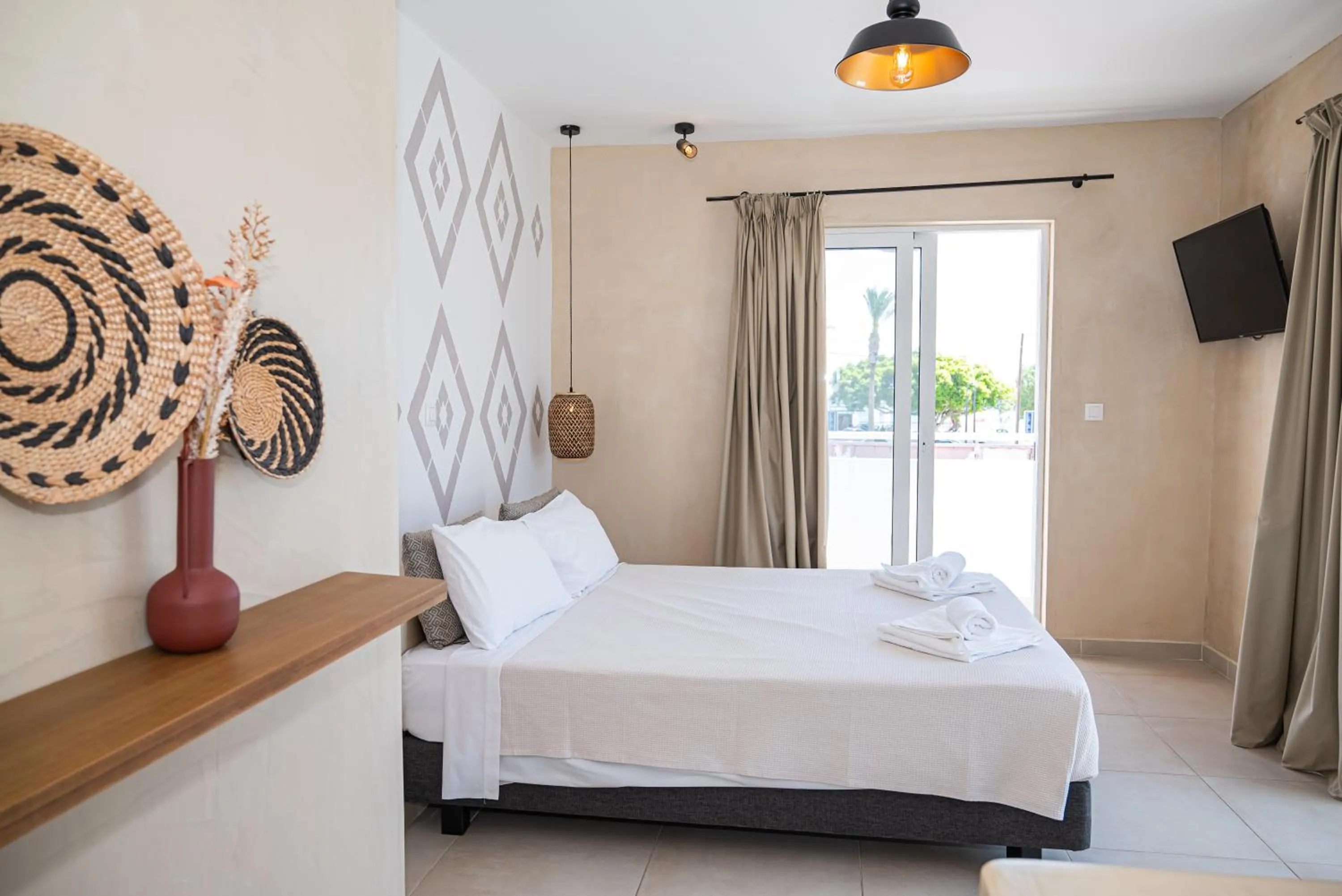Bed in Atma Beach Rooms & Suites