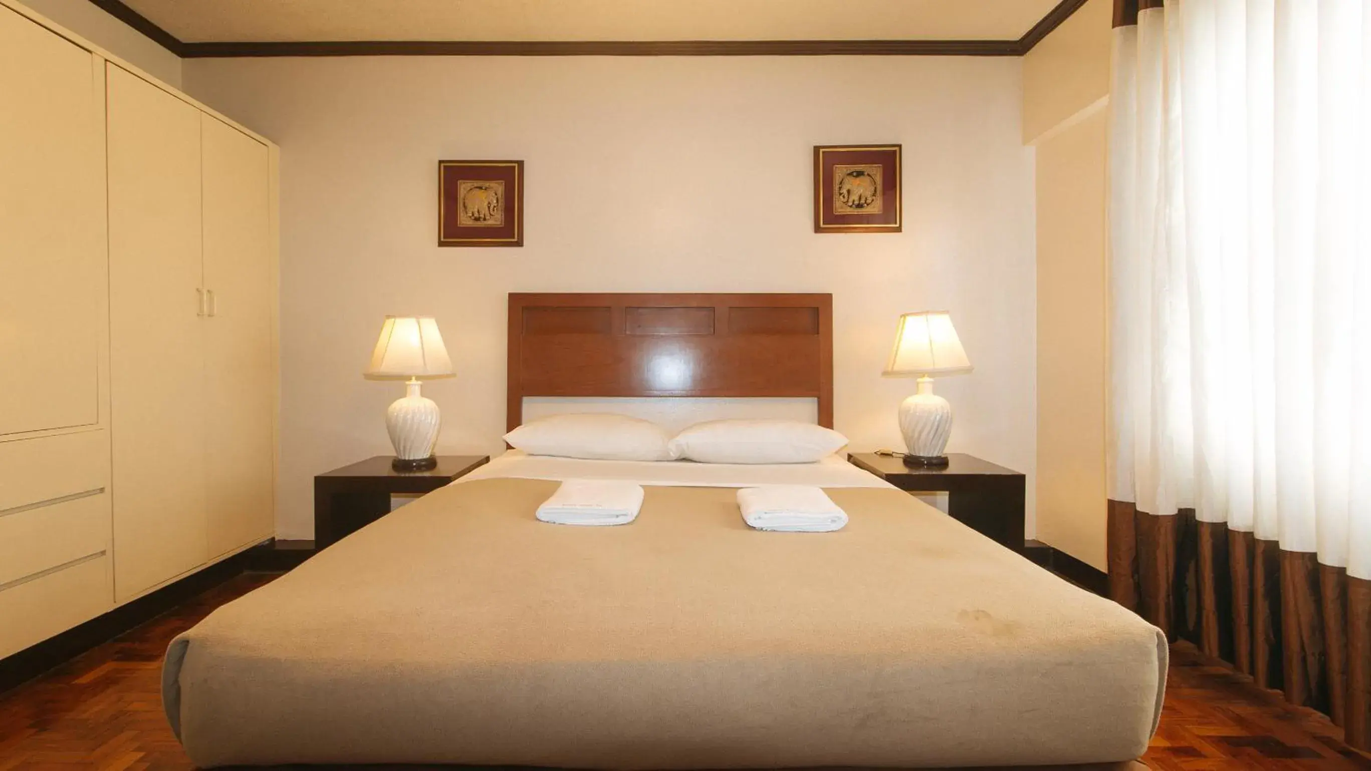 Bed in El Rico Suite Makati by RedDoorz Bed in El Rico Suite Makati by RedDoorz