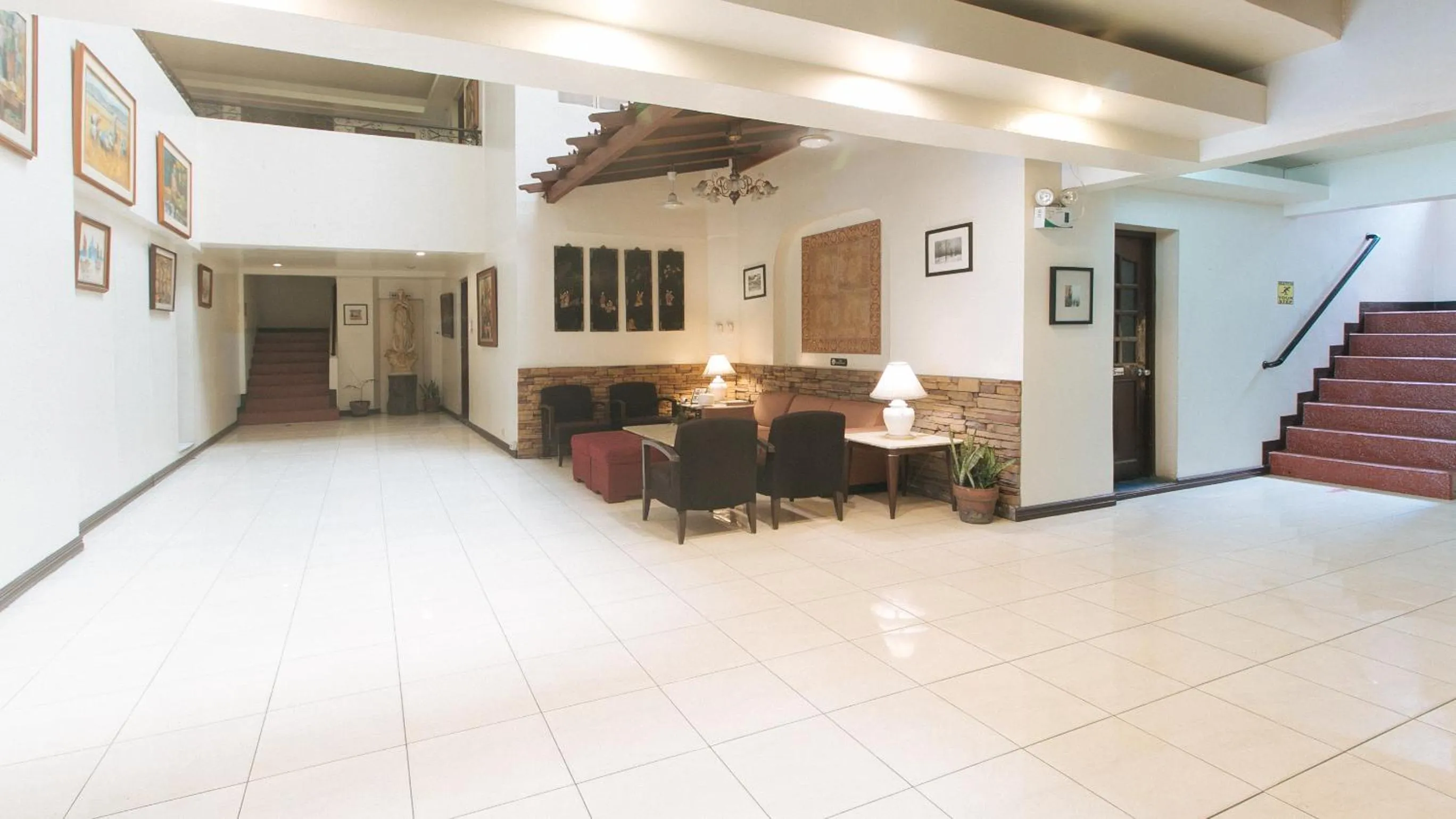 Lobby or reception in El Rico Suite Makati by RedDoorz