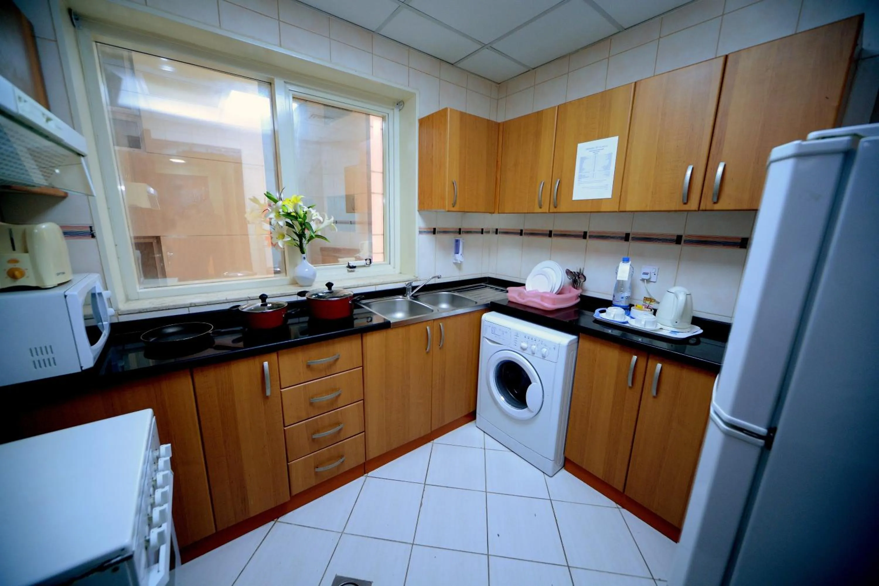 Kitchen or kitchenette in Emirates Stars Hotel Apartments Sharjah