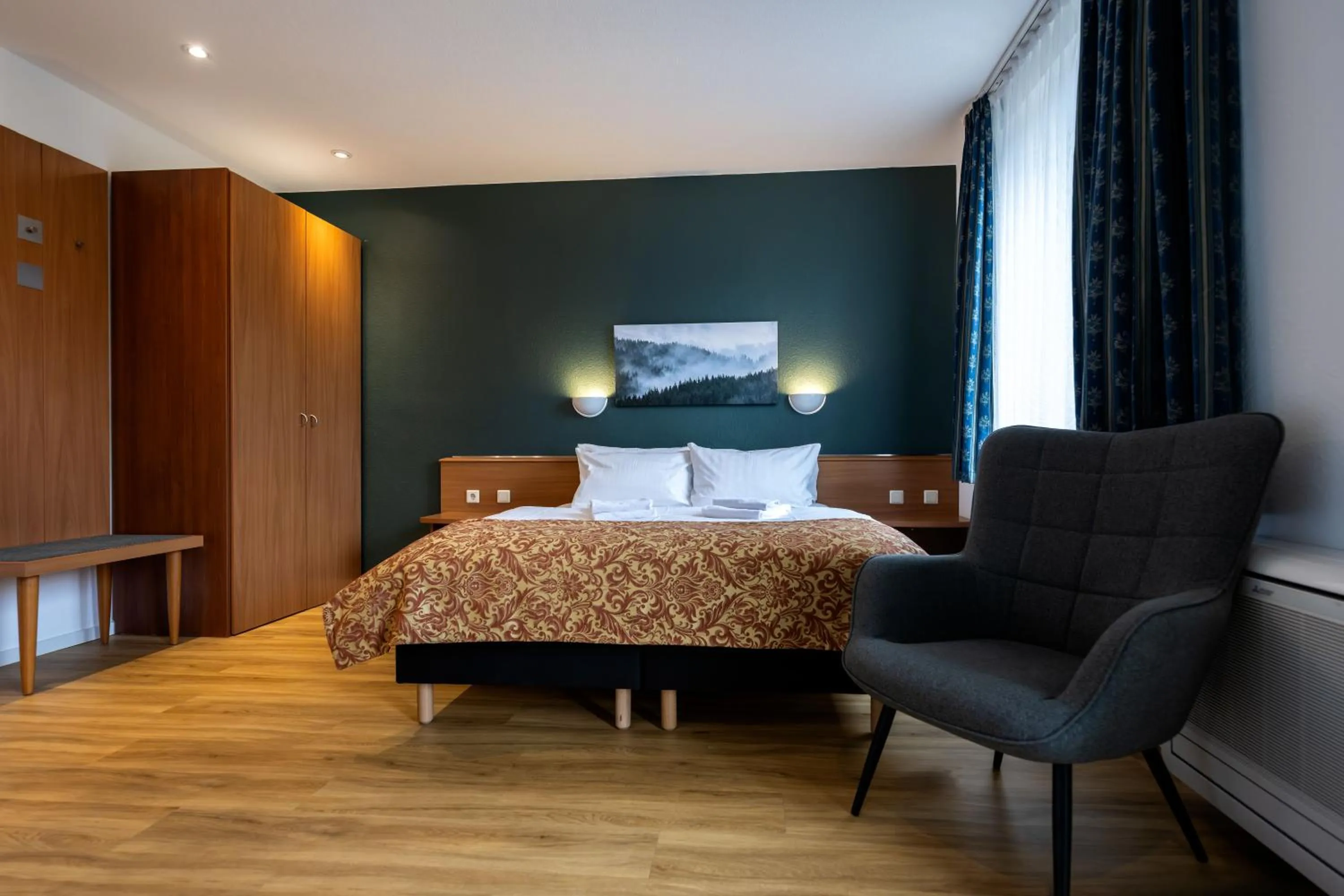 Photo of the whole room, Bed in Parkhotel Hohnstein by STEIGER Hotels