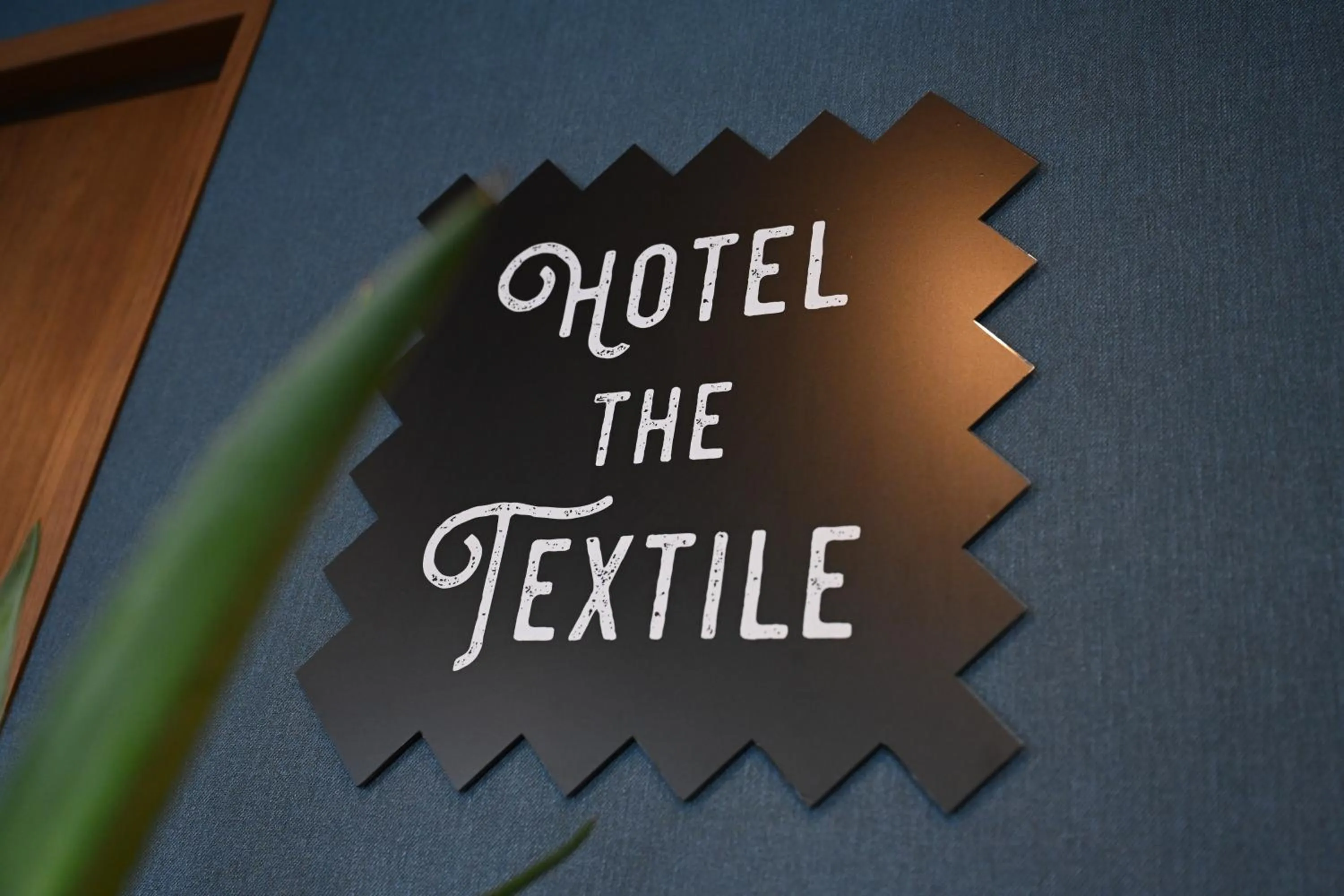Property logo or sign in hotel the textile