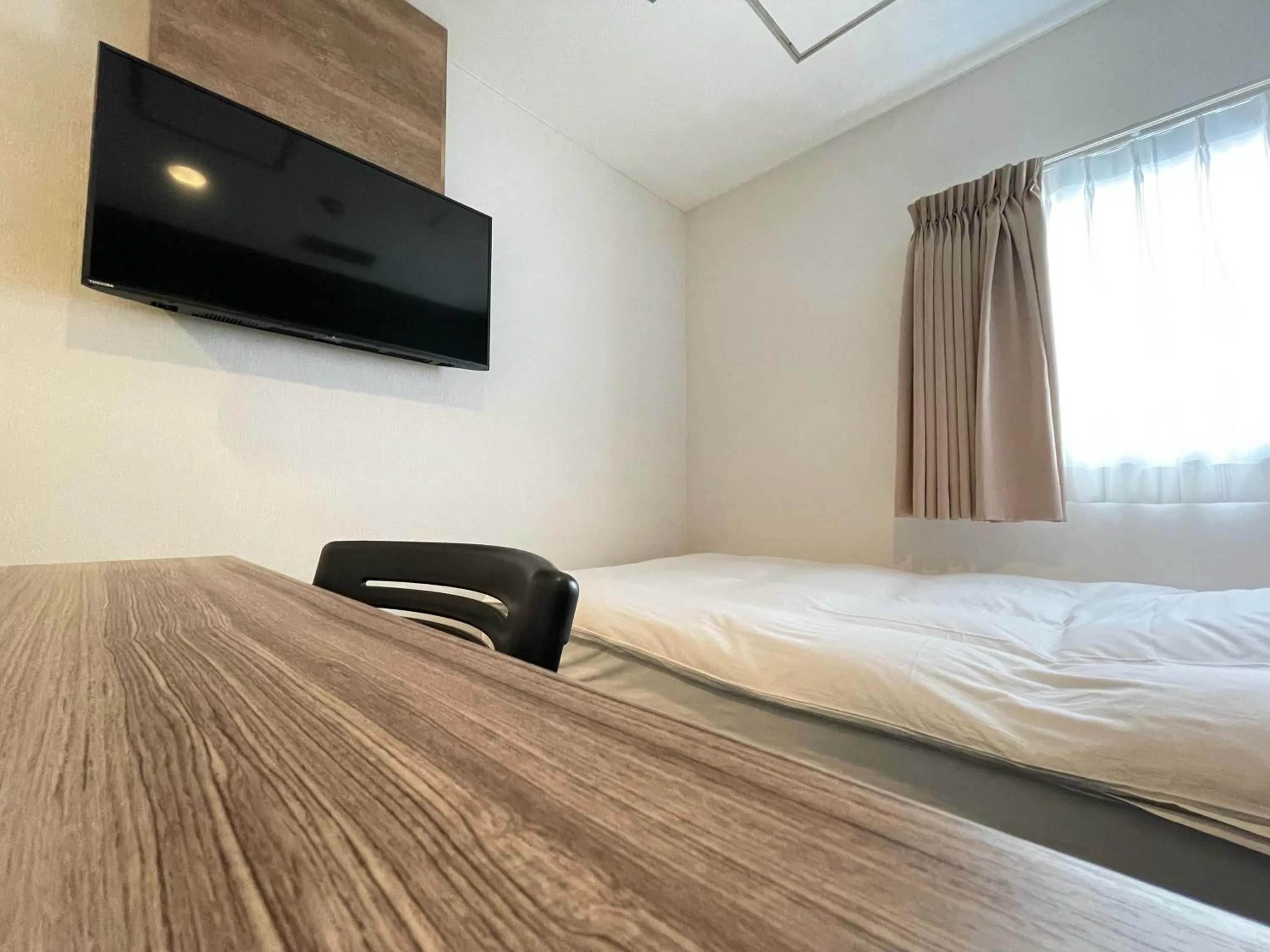 Photo of the whole room, Bed in hotel the textile