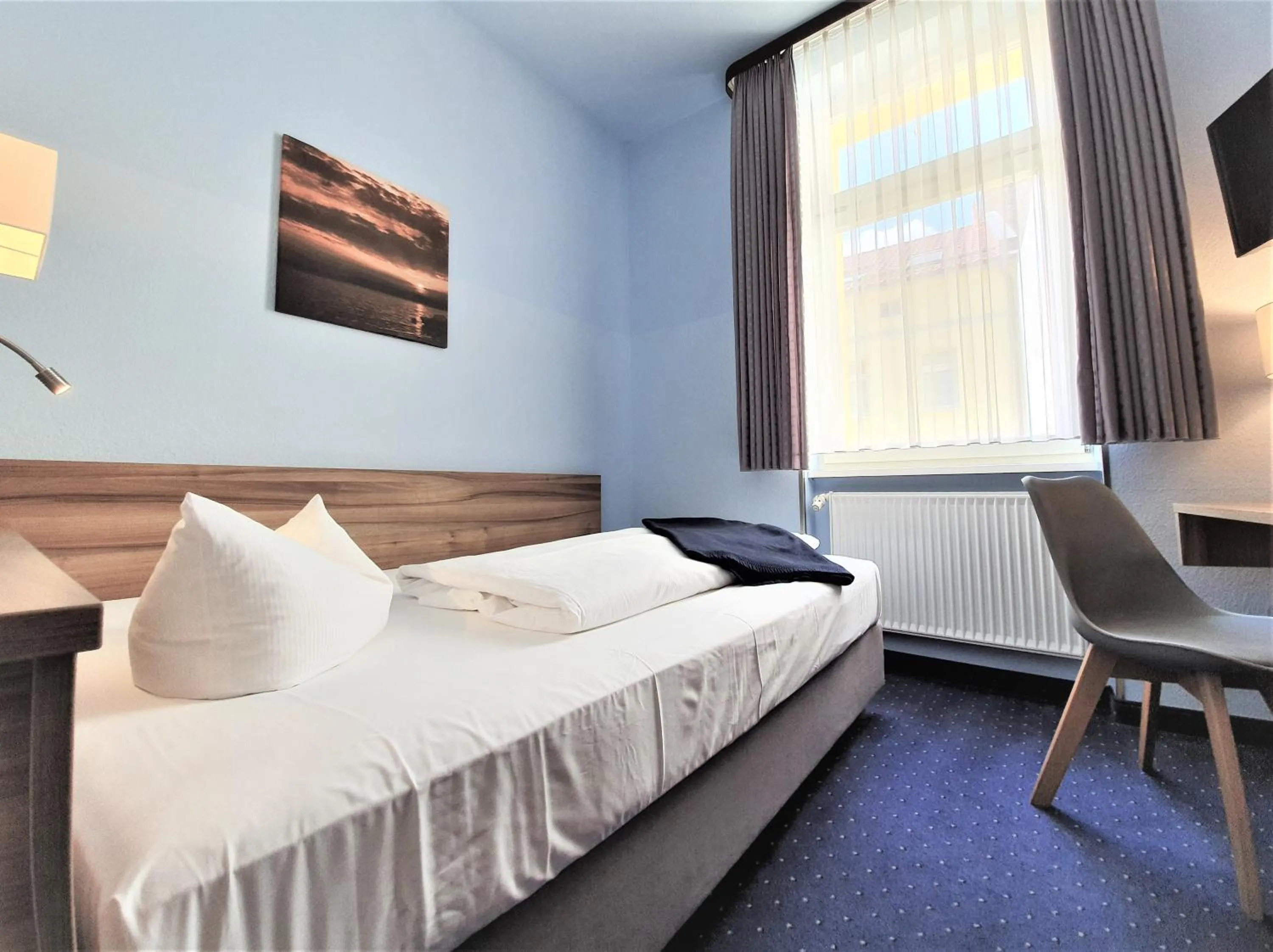 Bed in Melarose Feng Shui Hotel