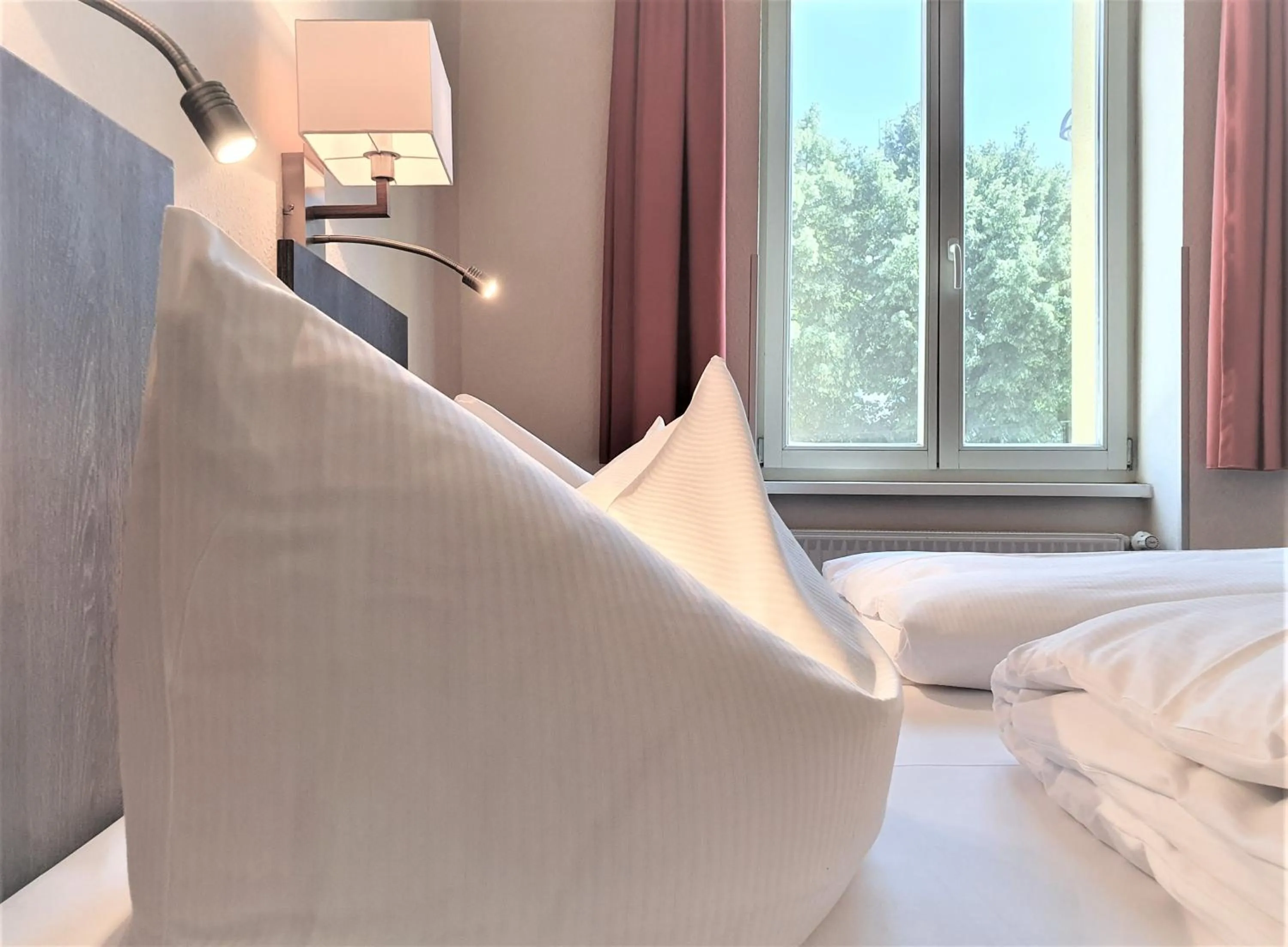 Bed in Melarose Feng Shui Hotel