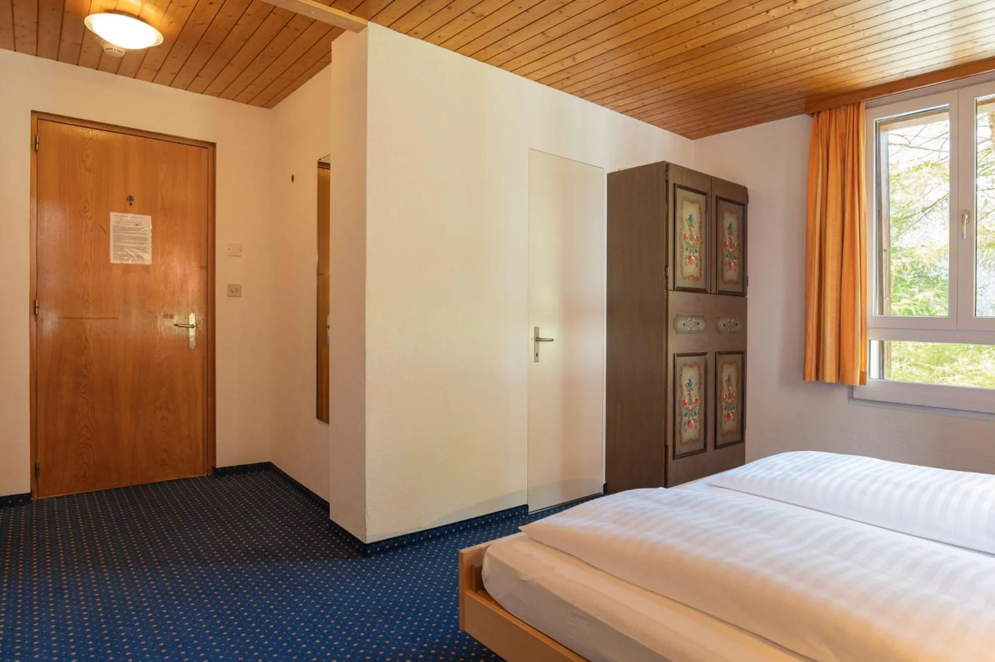 Bed in Hotel Bellevue - Traditional Swiss Hideaway