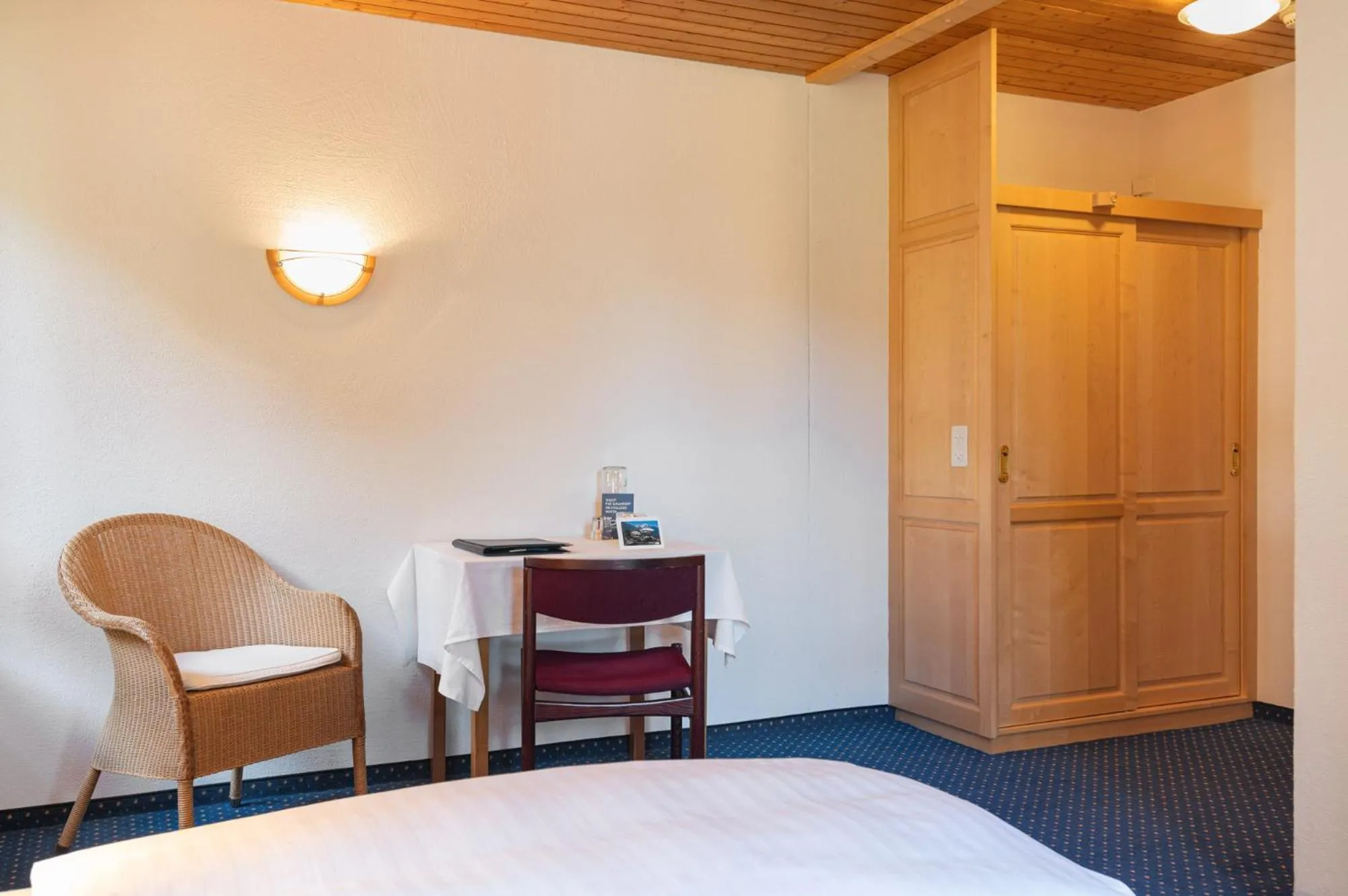 Bed in Hotel Bellevue - Traditional Swiss Hideaway