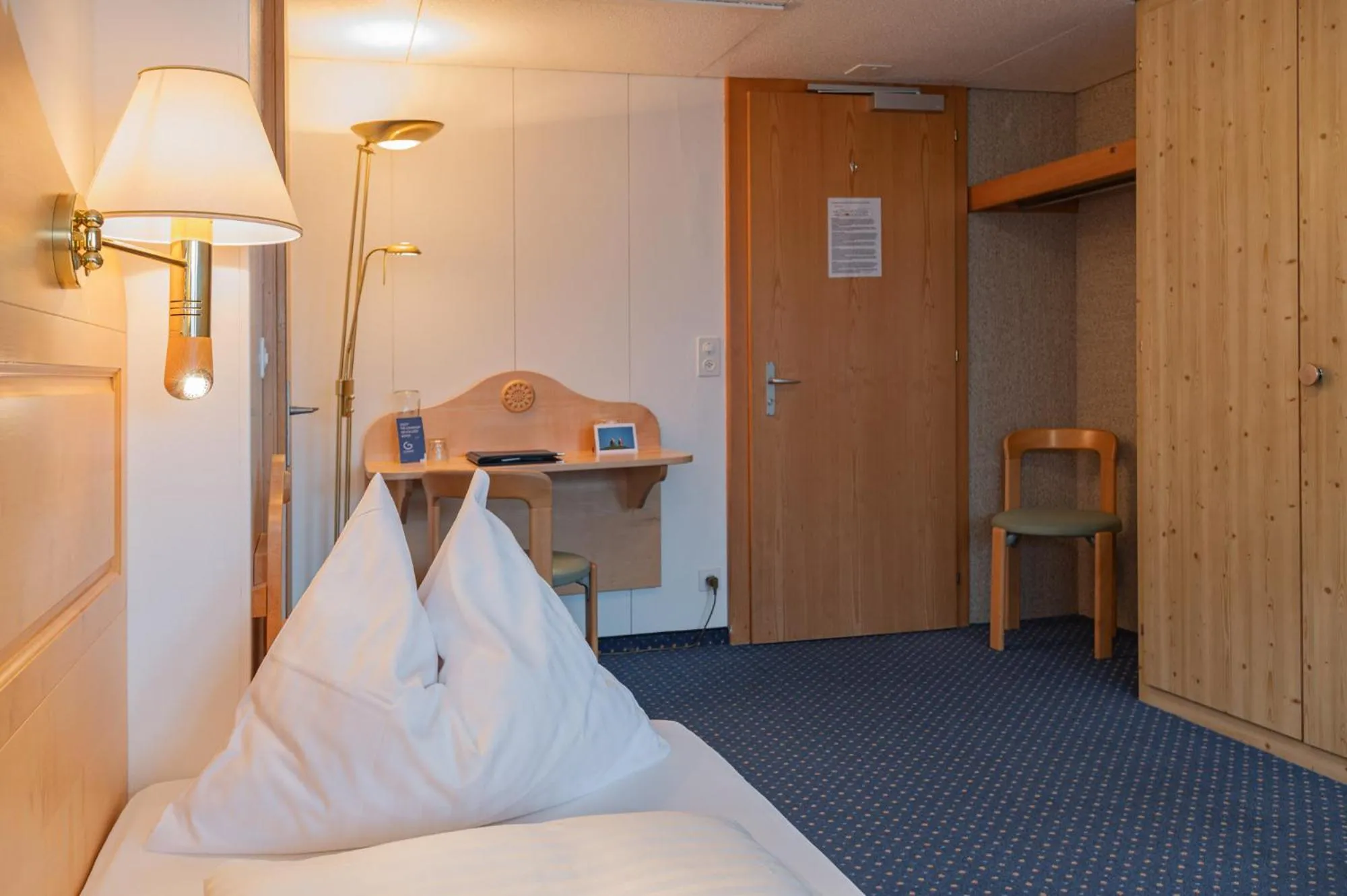 Bed in Hotel Bellevue - Traditional Swiss Hideaway